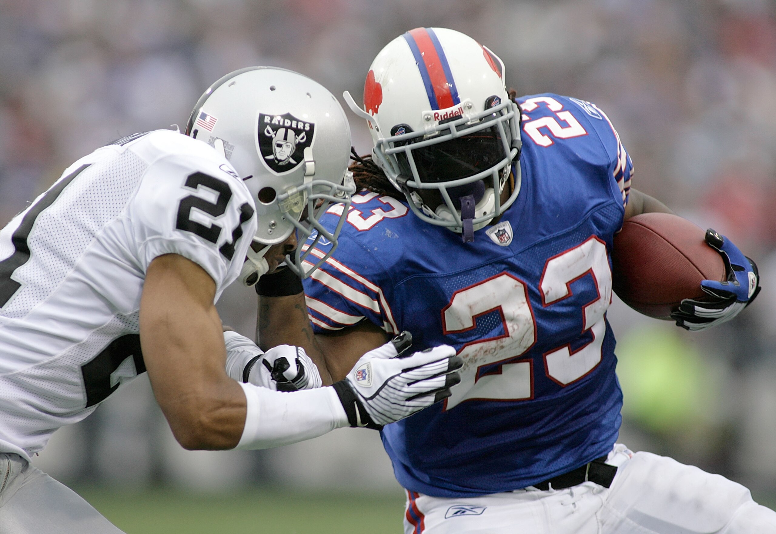 ORCHARD PARK, NY - SEPTEMBER 21: Marshawn Lynch #23 of the Buffalo Bills runs against Nnamdi Asomugha #21 of the Oakland Raiders on September 21, 2008 at Ralph Wilson Stadium in Orchard Park, New York. Buffalo won 24-23.  (Photo by Rick Stewart/Getty Imag
