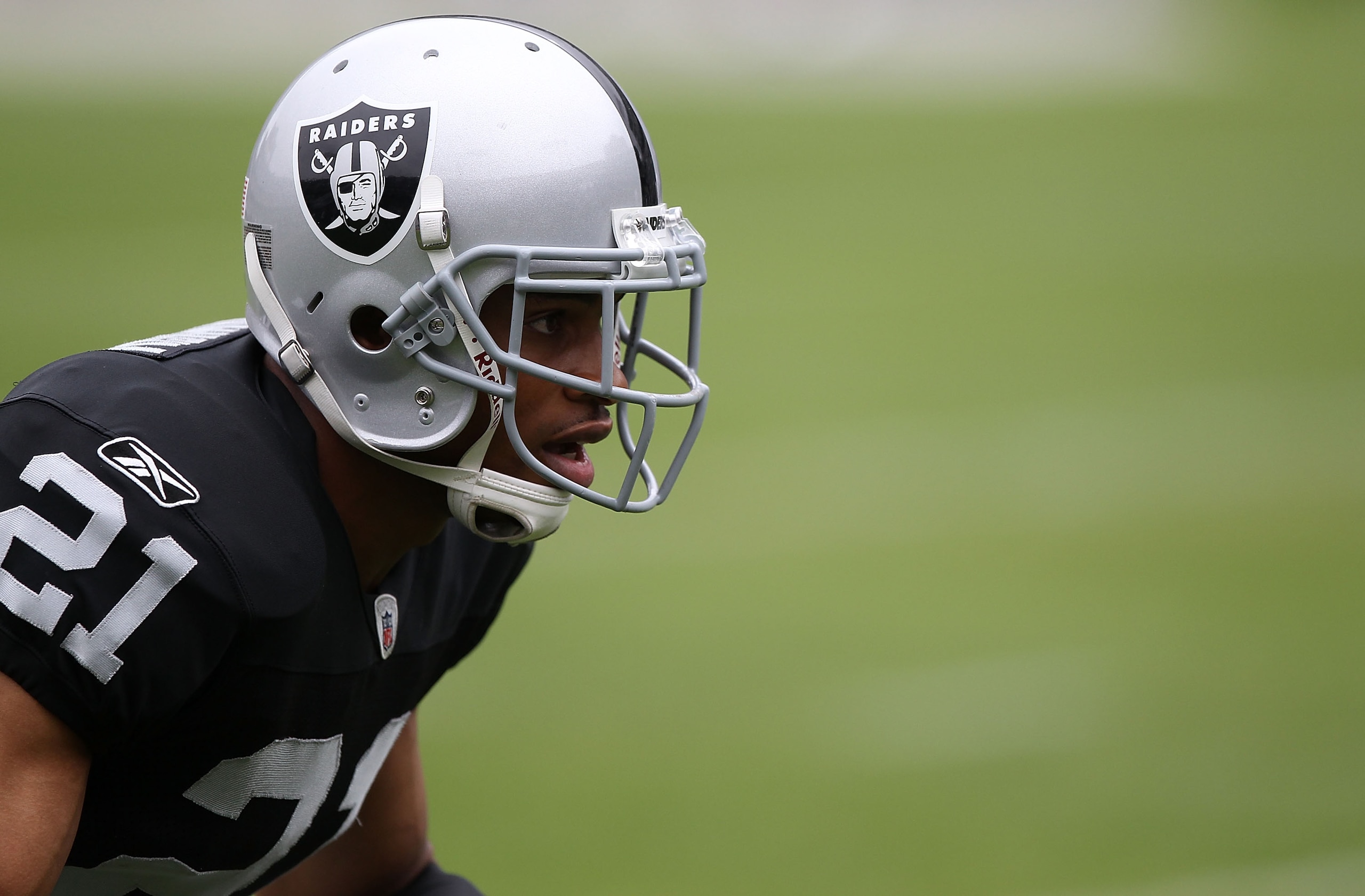 OAKLAND, CA - SEPTEMBER 19:  Nnamdi Asomugha #21 of the Oakland Raiders warms up against the St. Louis Rams during an NFL game at Oakland-Alameda County Coliseum on September 19, 2010 in Oakland, California.  (Photo by Jed Jacobsohn/Getty Images)