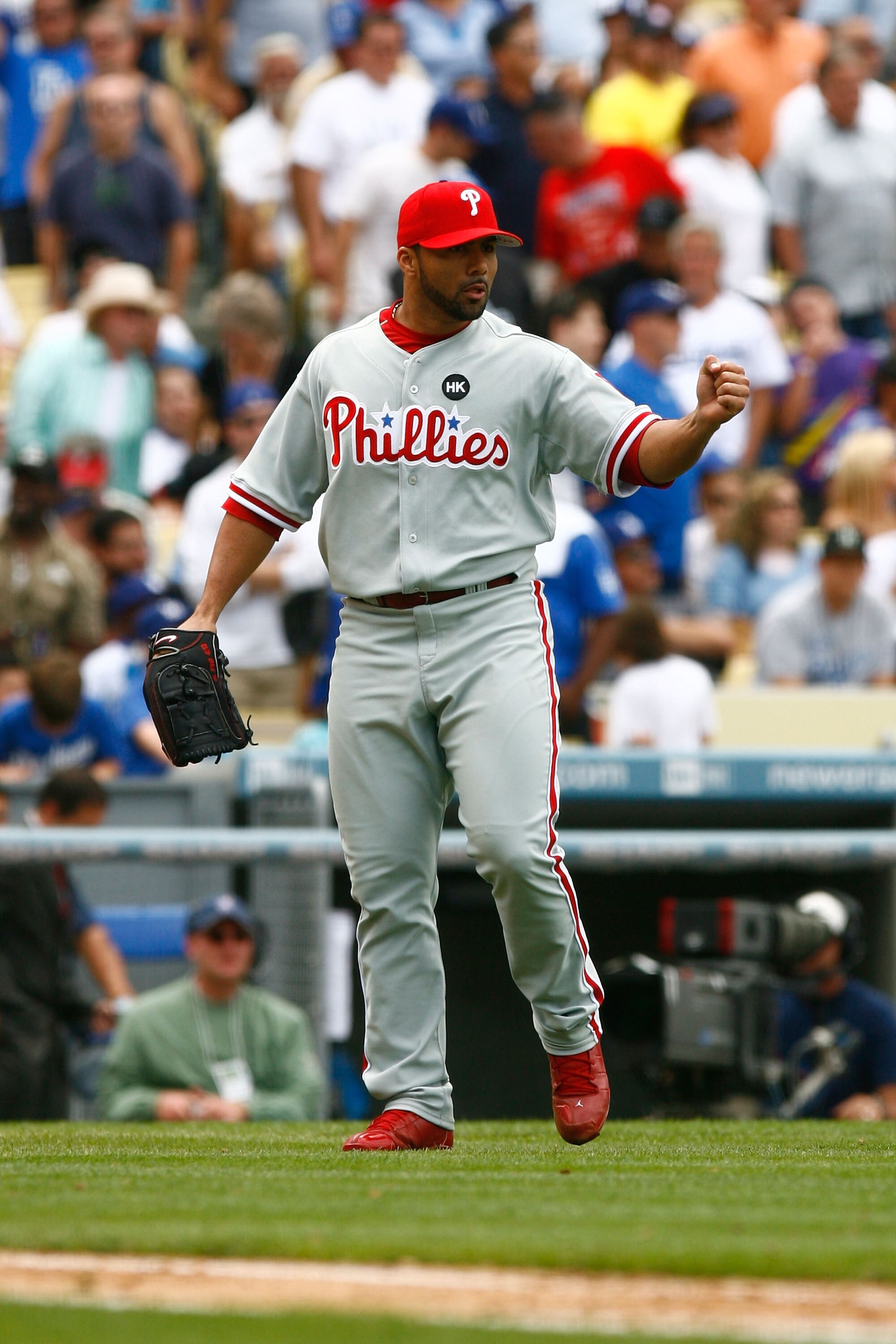 LOS ANGELES, CA - JUNE 06:  Relief pitcher J.C. Romero #16 of the Philadelphia Phillies pumps his fist after getting Orlando Hudson of the Los Angeles Dodgers to pop out in the seventh inning at Dodger Stadium on June 6, 2009 in Los Angeles, California. T