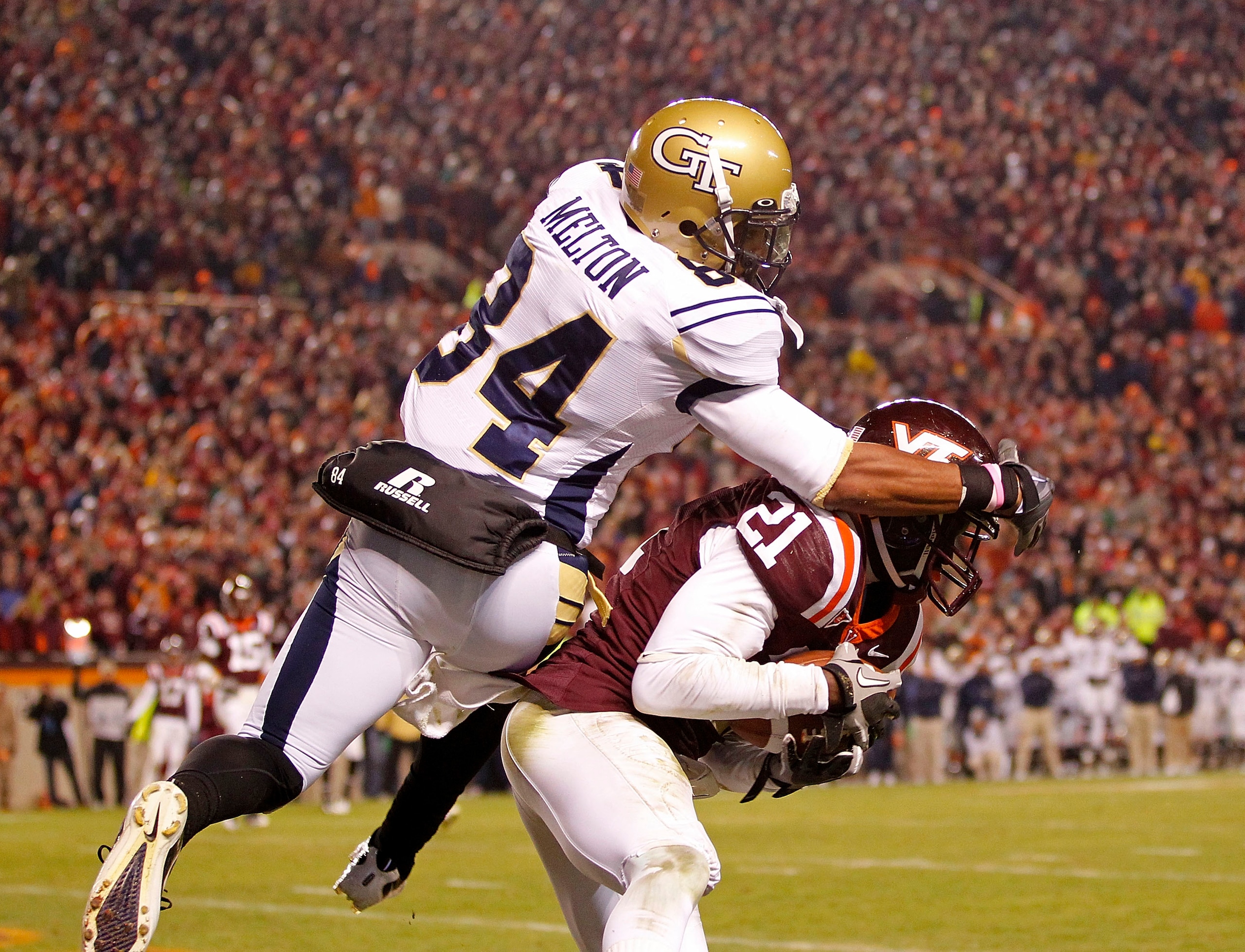 BLACKSBURG, VA - NOVEMBER 04:  Cornerback Rashad Carmichael #21 of the Virginia Tech Hokies intercepts a pass in the end zone in the final seconds intended for wide receiver Tyler Melton #84 of the Georgia Tech Yellow Jackets at Lane Stadium on November 4
