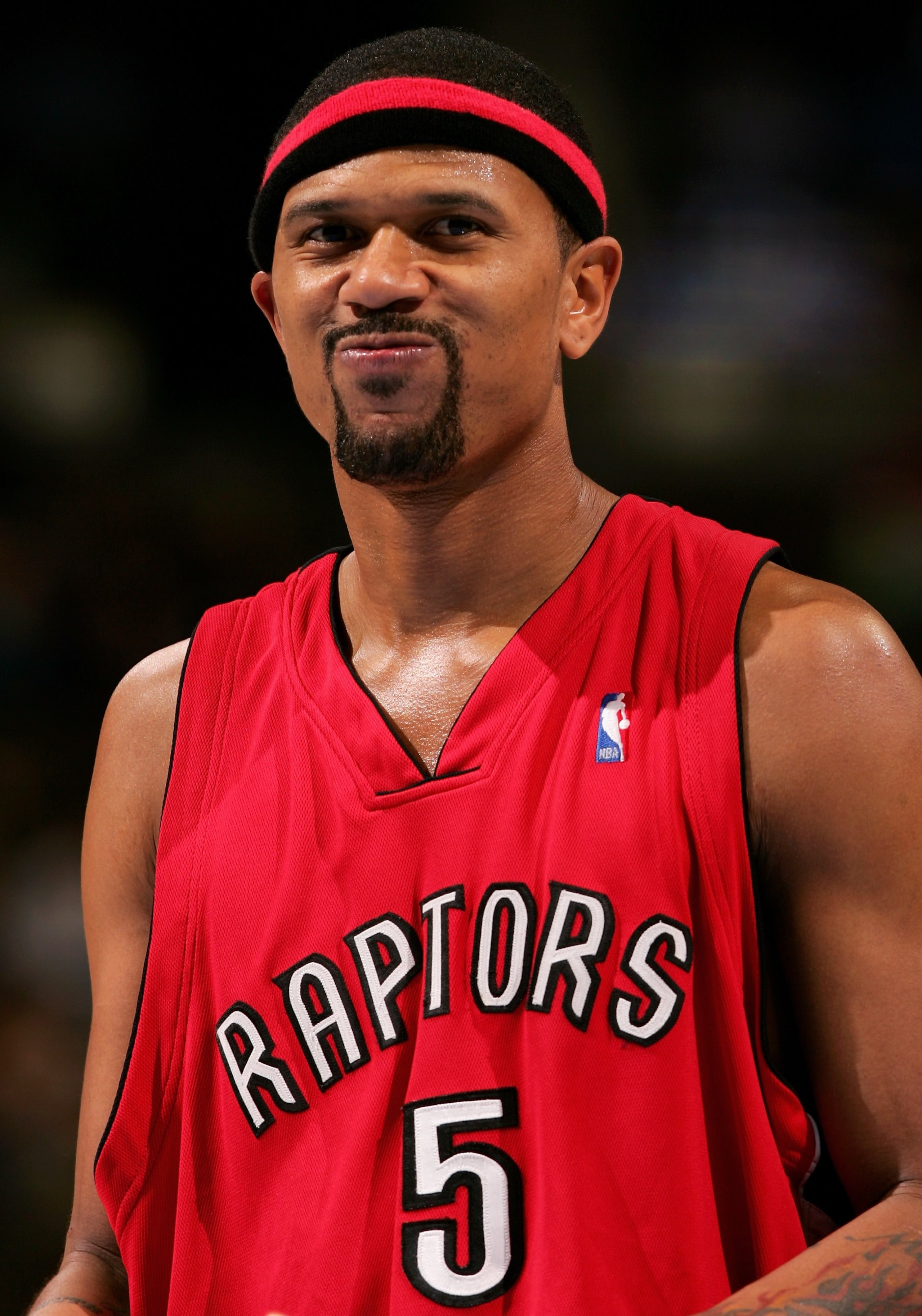 DENVER - JANUARY 23:  Jalen Rose #5 of the Toronto Raptors reacts to the taunting of a fan against the Denver Nuggets as the Nuggets defeated the Raptors 107-101 during NBA action on January 23, 2006 at the Pepsi Center in Denver, Colorado.  (Photo by Dou