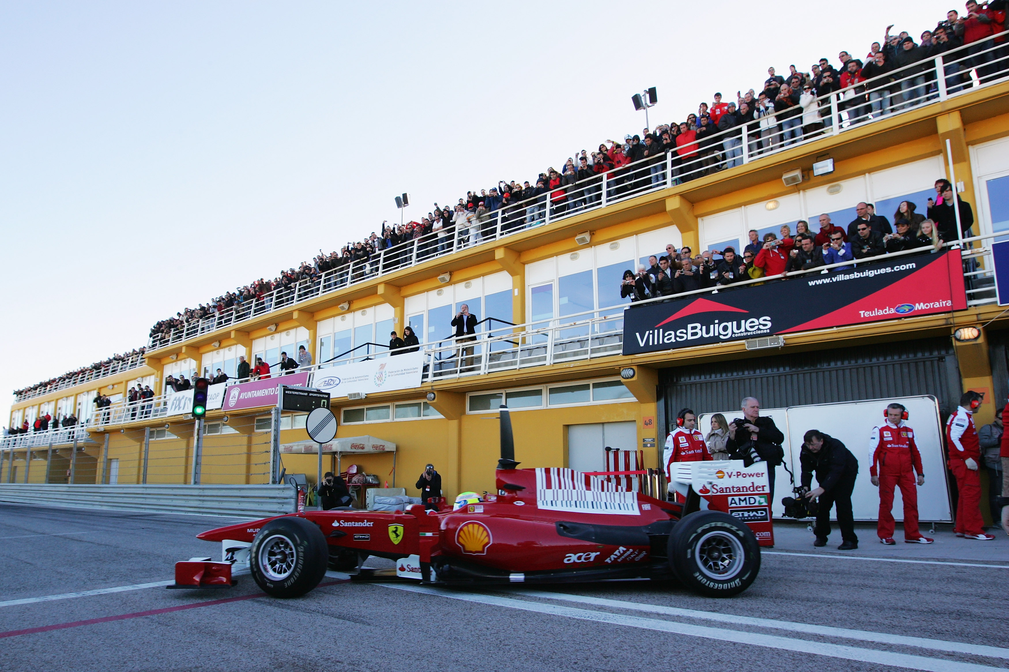VALENCIA, SPAIN - FEBRUARY 01:  Felipe Massa of Brazil and Ferrari exits his garage for the first time to drive during winter testing at the Ricardo Tormo Circuit on February 1, 2010 in Valencia, Spain.  (Photo by Ker Robertson/Getty Images)