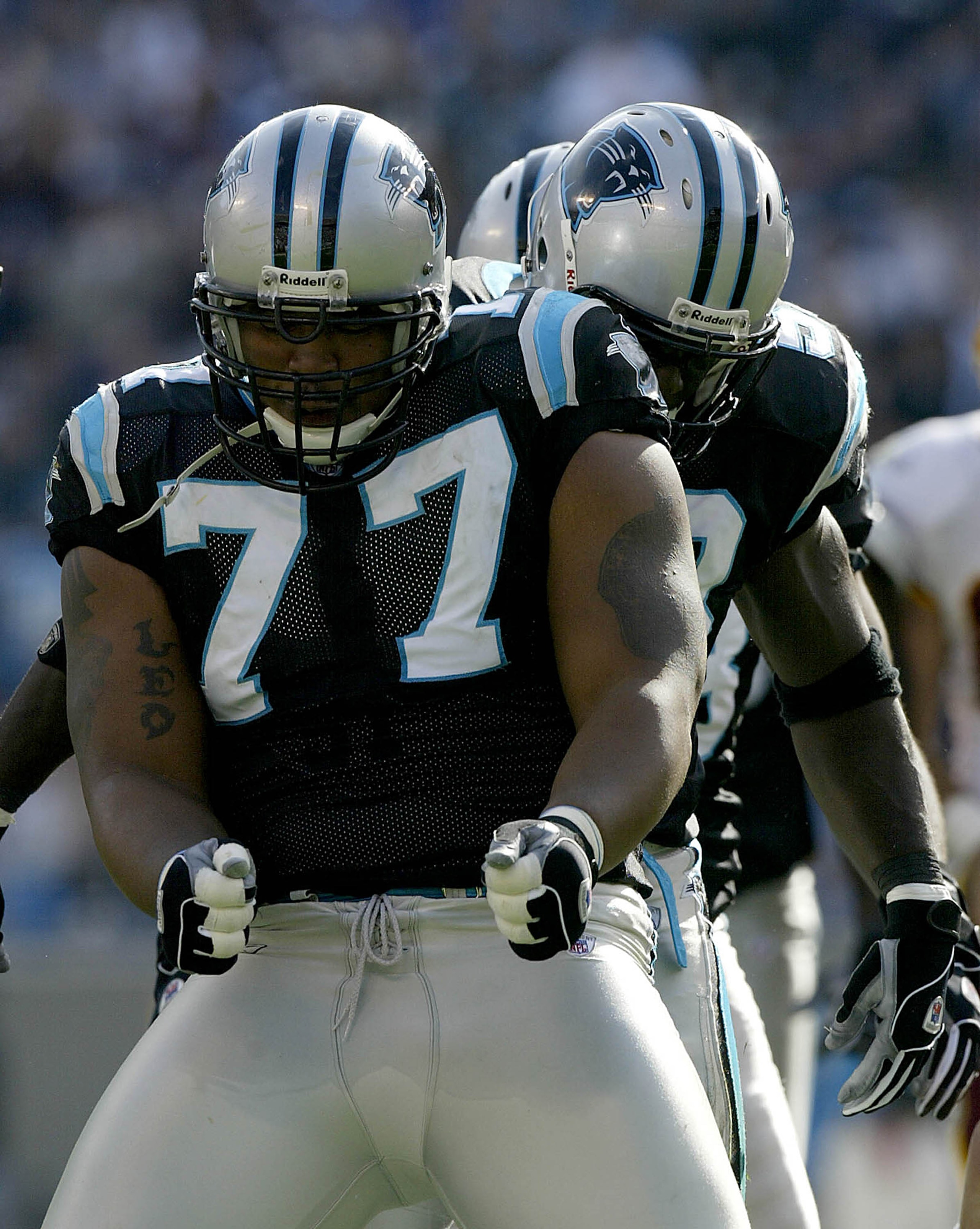 CHARLOTTE, NC - NOVEMBER 16: Kris Jenkins #77 of the Carolina Panthers dances after a sack against the Washington Redskins on November 16, 2003 at Ericsson Stadium in Charlotte, North Carolina.  (Photo by Craig Jones/Getty Images)