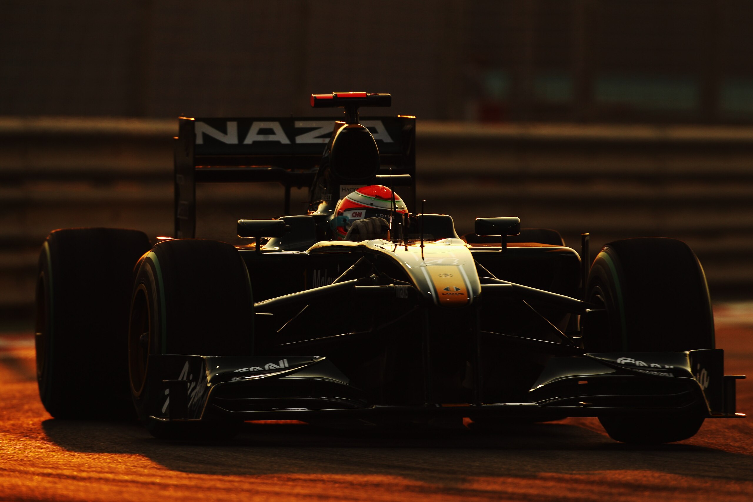 ABU DHABI, UNITED ARAB EMIRATES - NOVEMBER 13:  Jarno Trulli of Italy and Lotus drives during qualifying for the Abu Dhabi Formula One Grand Prix at the Yas Marina Circuit on November 13, 2010 in Abu Dhabi, United Arab Emirates.  (Photo by Mark Thompson/G