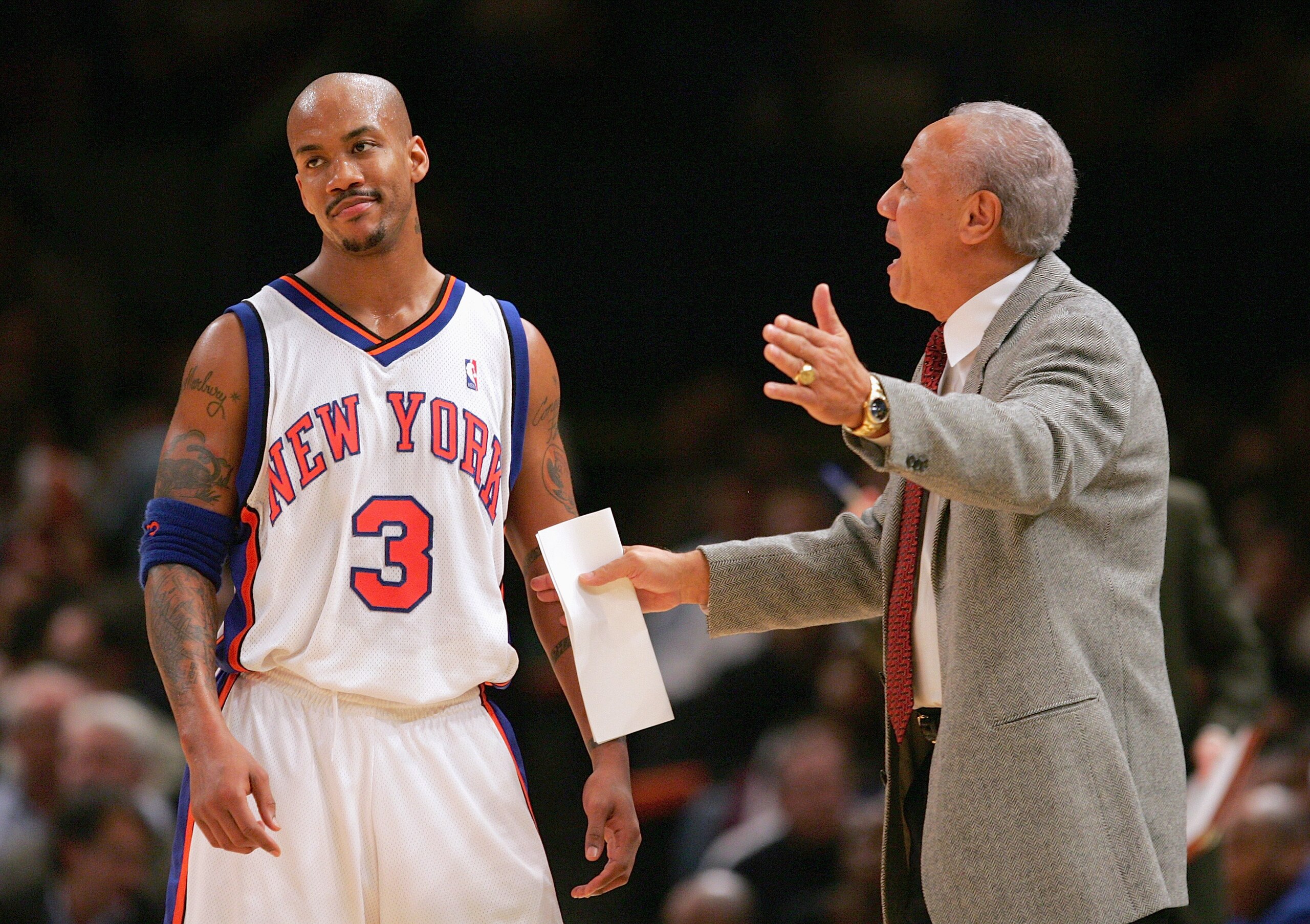 NEW YORK - NOVEMBER 23:  Stephon Marbury #3 of the New York Knicks speaks with head coach Lenny Wilkins while playing against the Atlanta Hawks on November 23, 2004 at Madison Square Garden in New York City.  The Knicks defeated the Hawks 104-88.  NOTE TO