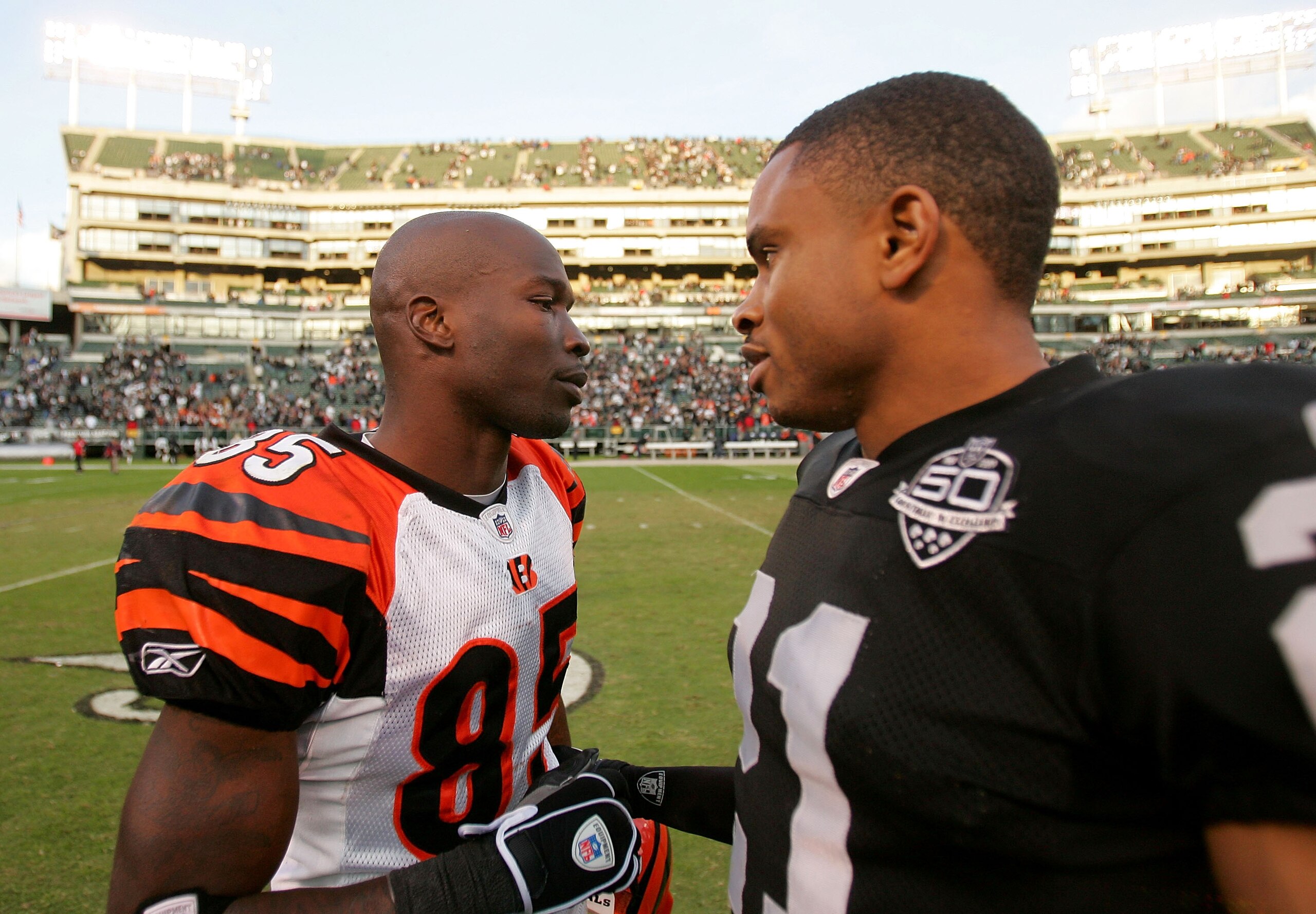 OAKLAND, CA - NOVEMBER 22:  Chad Ochocinco #85 of the Cincinnati Bengals is consoled by Nnamdi Asomugha #21 of the Oakland Raiders after the Raiders beat the Bengals at Oakland-Alameda County Coliseum on November 22, 2009 in Oakland, California.  (Photo b