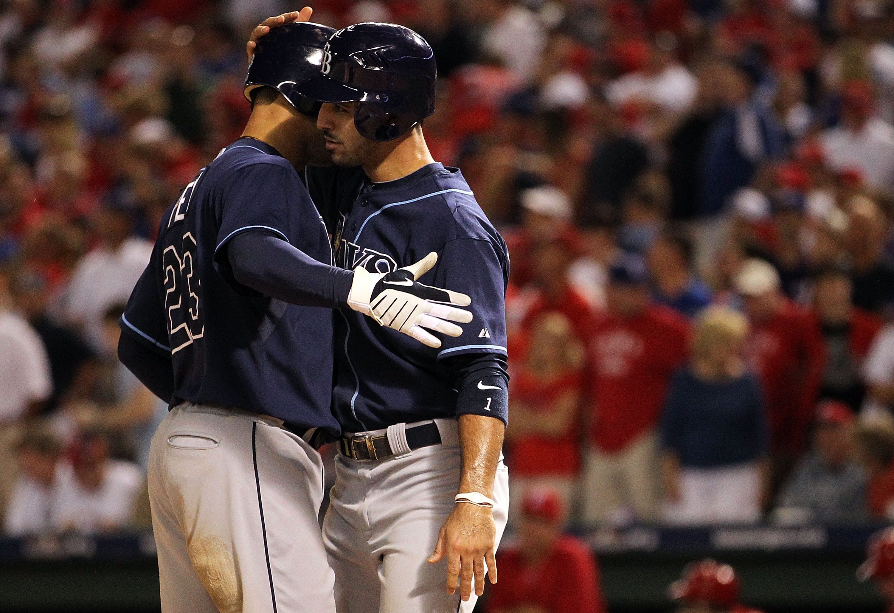 ARLINGTON, TX - OCTOBER 09:  (L-R) Carlos Pena #23 of the Tampa Bay Rays celebrates a two run homerun with Sean Rodriguez #1 in the 9th inning against the Texas Rangers during game 3 of the ALDS at Rangers Ballpark in Arlington on October 9, 2010 in Arlin