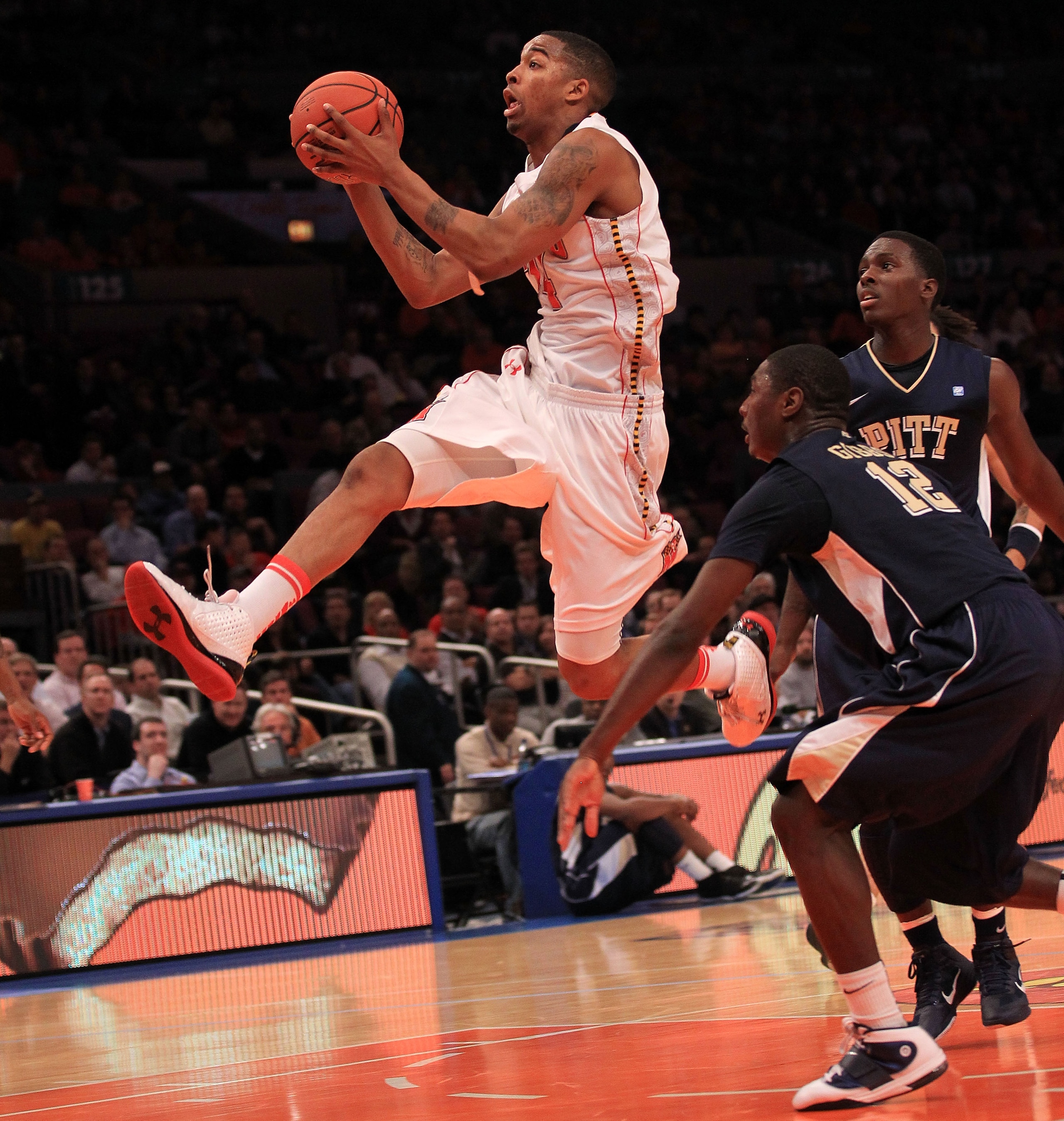 NEW YORK - NOVEMBER 18: Cliff Tucker #24 of the Maryland Terrapins drives past Ashton Gibbs #12 of the Pittsburgh Panther during the 2k Sports Classic at Madison Square Garden on November 18, 2010 in New York, New York.  (Photo by Chris McGrath/Getty Imag