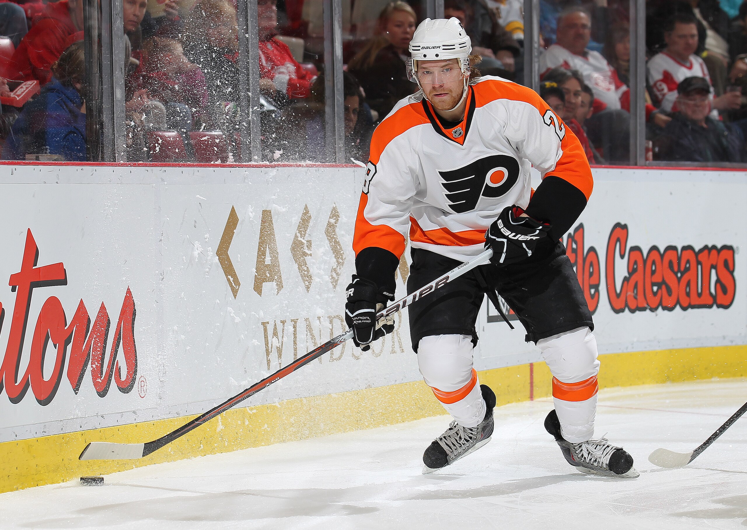 DETROIT, MI - JANUARY 2:  Claude Giroux #28 of the Philadelphia Flyers gets set to make a pass in a game against the Detroit Red Wings on January 2, 2011 at the Joe Louis Arena in Detroit, Michigan. (Photo by Claus Andersen/Getty Images)