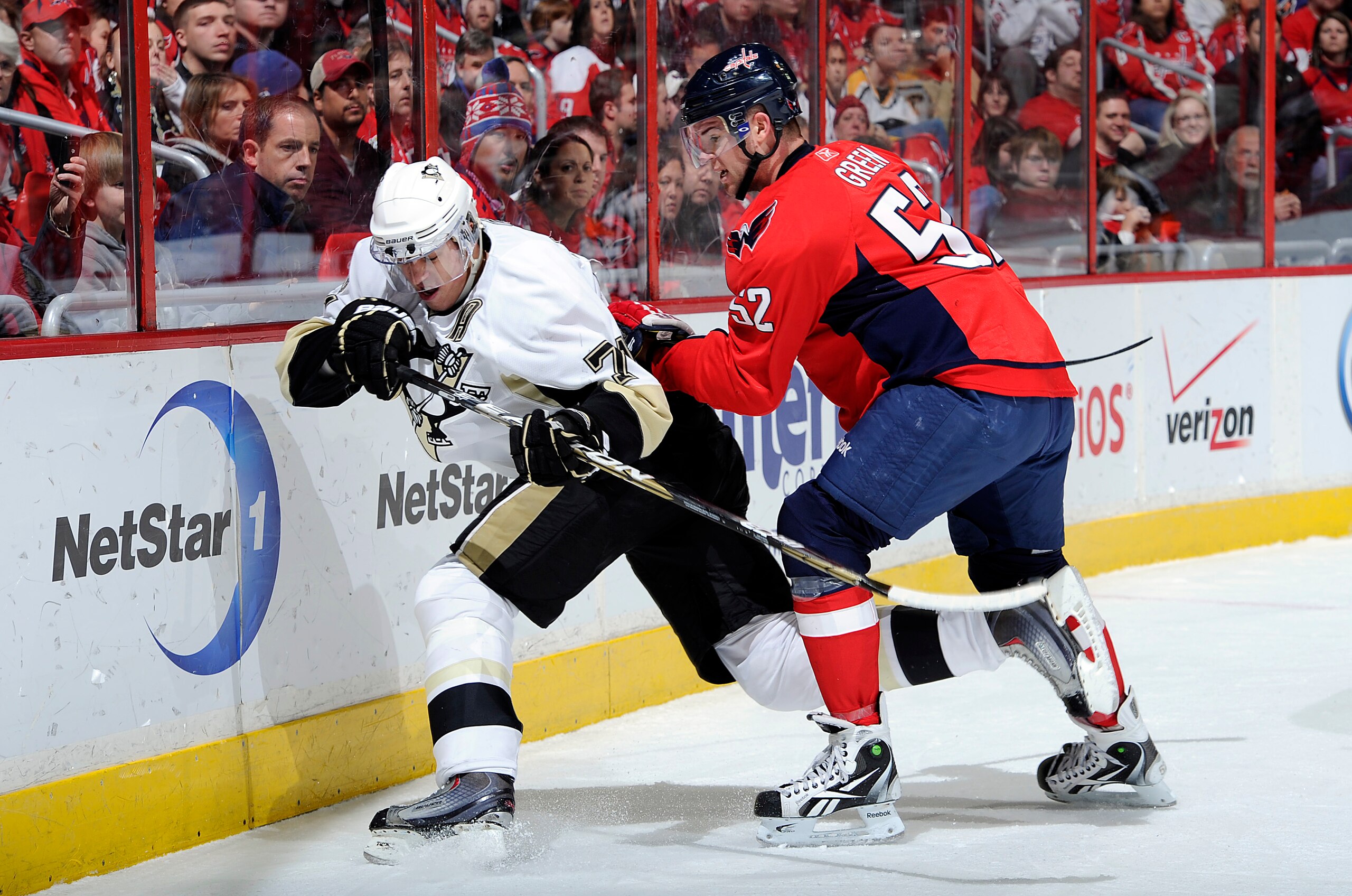 WASHINGTON, DC - DECEMBER 23:  Mike Green #52 of the Washington Capitals battles for the puck against Evgeni Malkin #71 of the Pittsburgh Penguins at the Verizon Center on December 23, 2010 in Washington DC.  (Photo by Greg Fiume/Getty Images)