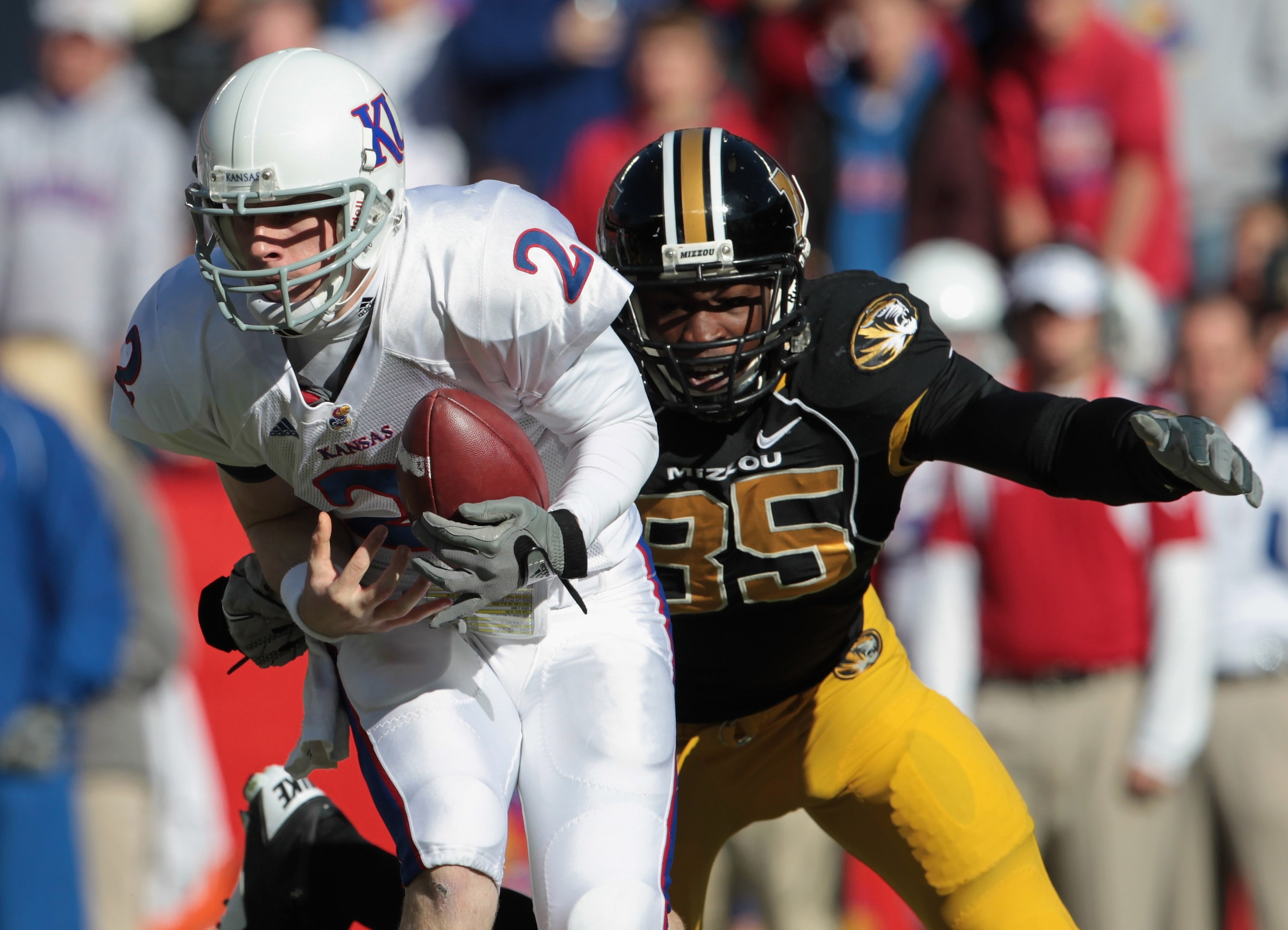 KANSAS CITY, MO - NOVEMBER 27:  Quarterback Jordan Webb #2 of the Kansas Jayhawks is sacked by Aldon Smith #85 of the Missouri Tigers during the game on November 27, 2010 at Arrowhead Stadium in Kansas City, Missouri.  (Photo by Jamie Squire/Getty Images)