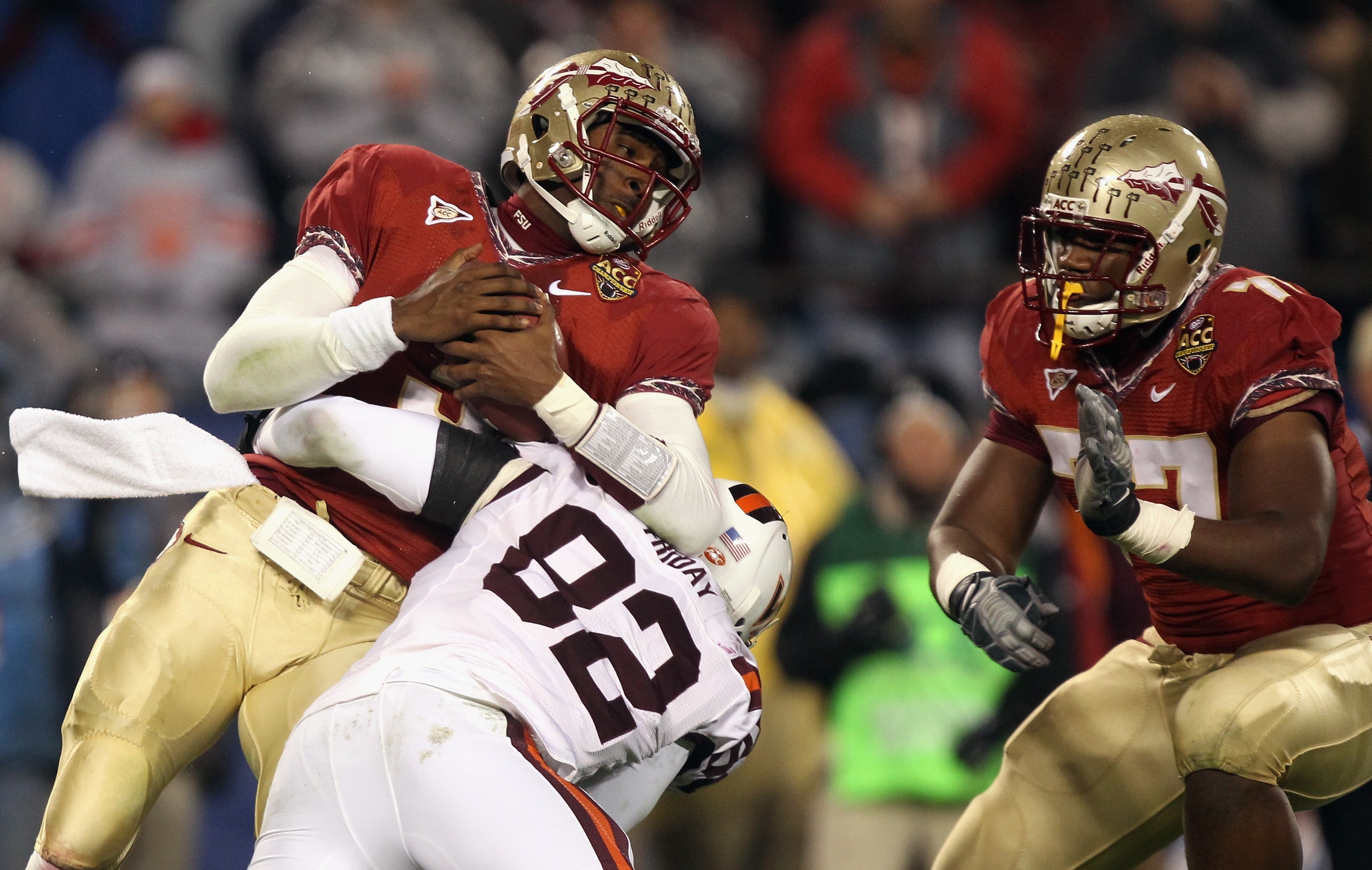 CHARLOTTE, NC - DECEMBER 04:  EJ Manuel #3 of the Florida State Seminoles is sacked by Steven Friday #82 of the Virginia Tech Hokies during their game at Bank of America Stadium on December 4, 2010 in Charlotte, North Carolina.  (Photo by Streeter Lecka/G