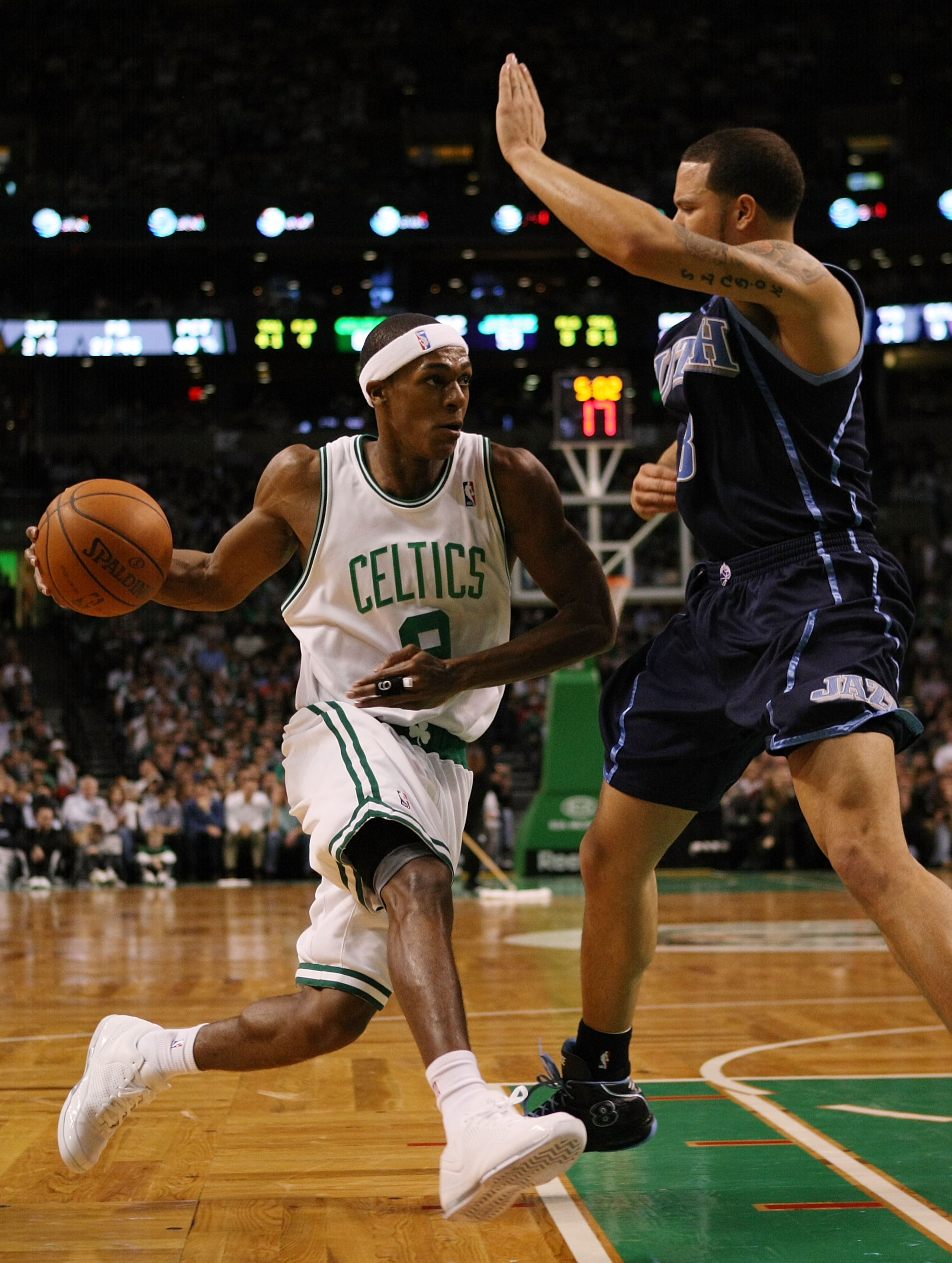 BOSTON - DECEMBER 15: Rajon Rondo #9 of the Boston Celtics heads for the net as Deron Williams #8 of the Utah Jazz defends on December 15, 2008 at TD Banknorth Garden in Boston, Massachusetts. The Celtics defeated the Jazz 100-91. NOTE TO USER: User expre