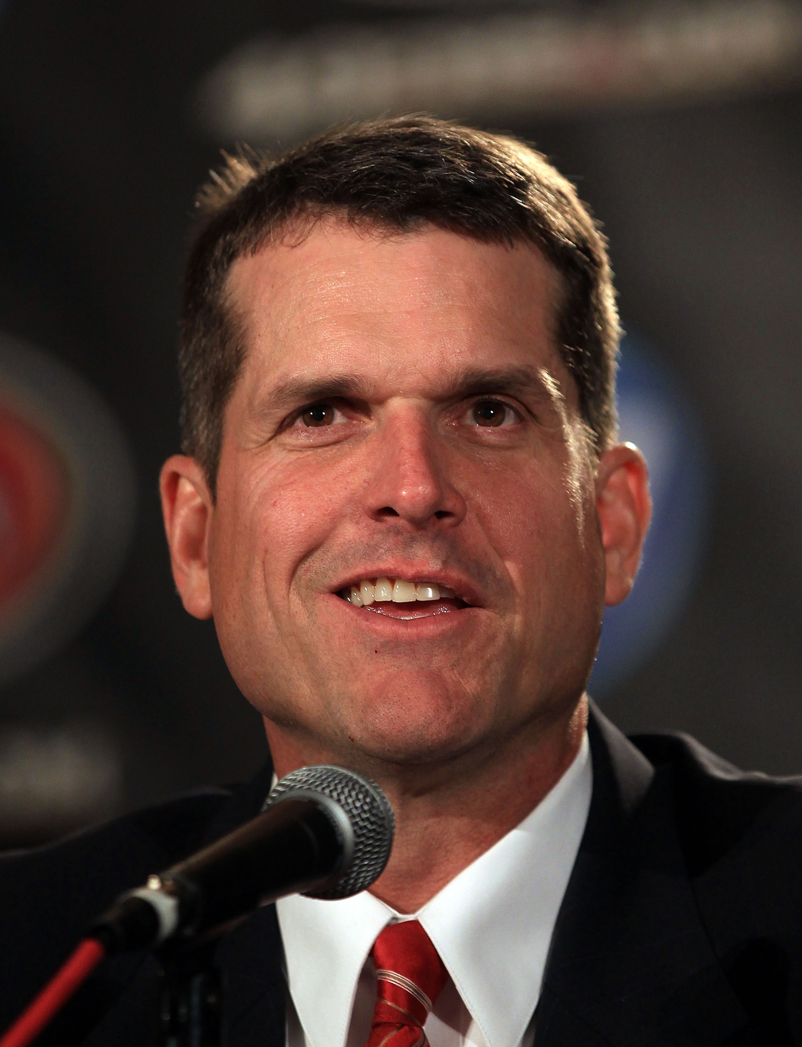 SAN FRANCISCO, CA - JANUARY 07: Jim Harbaugh speaks at a press conference where he was introduced as the new San Francisco 49ers head coach at the Palace Hotel on January 7, 2011 in San Francisco, California. (Photo by Ezra Shaw/Getty Images) SAN FRANCISCO, CA - JANUARY 07: Jim Harbaugh speaks at a press conference where he was introduced as the new San Francisco 49ers head coach at the Palace Hotel on January 7, 2011 in San Francisco, California. (Photo by Ezra Shaw/Getty Images)