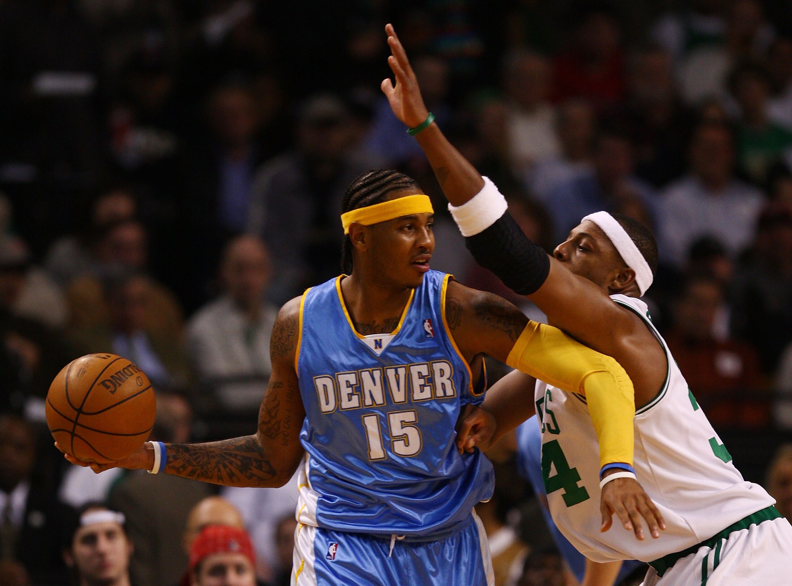 BOSTON - NOVEMBER 07:  Carmelo Anthony #15 of the Denver Nuggets looks to pass as Paul Pierce #34 of the Boston Celtics defends on November 7, 2007 at the TD Banknorth Garden in Boston, Massachusetts.  NOTE TO USER: User expressly acknowledges and agrees