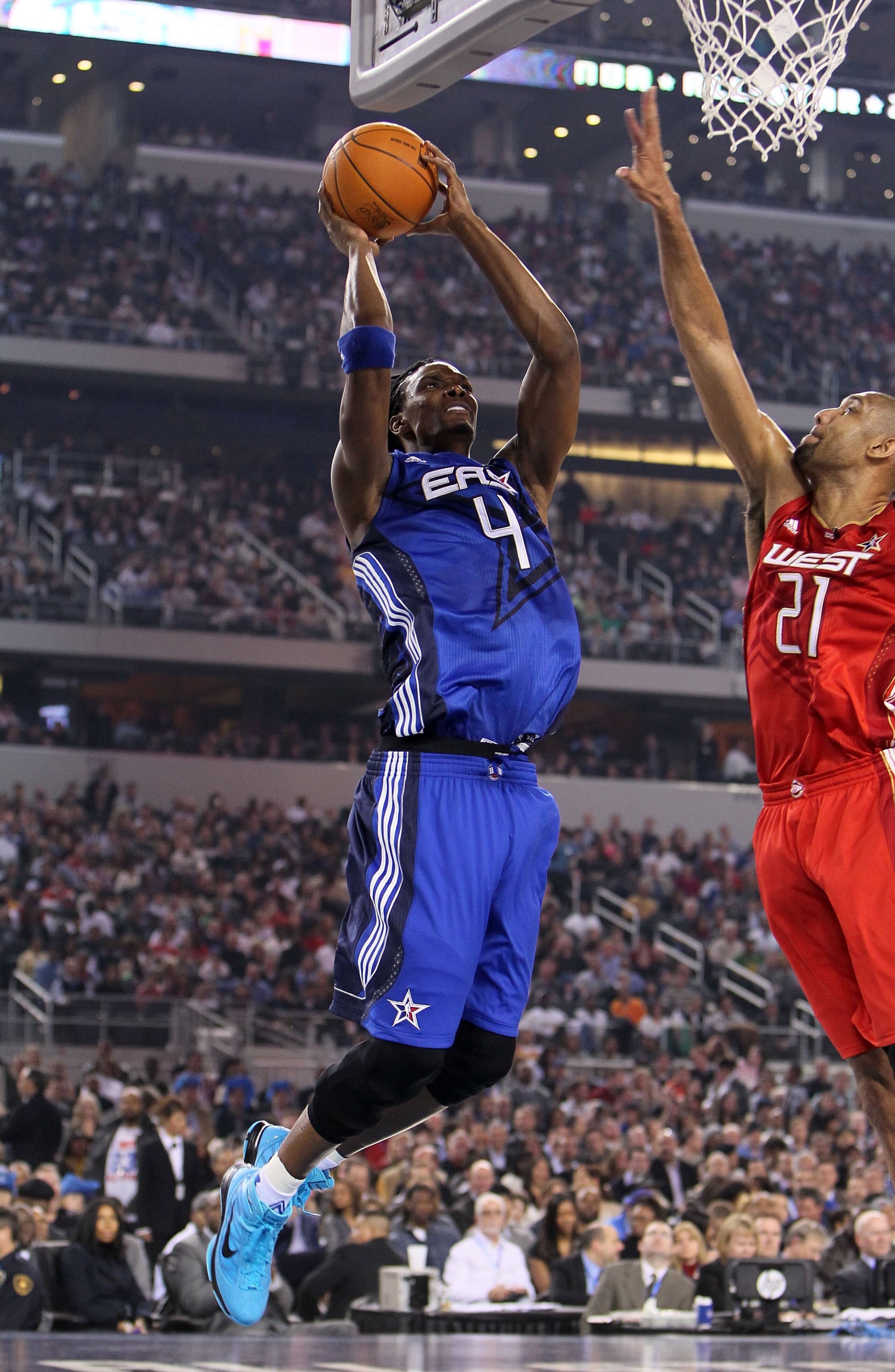 ARLINGTON, TX - FEBRUARY 14:  Chris Bosh #4 of the Eastern Conference shoots against Tim Duncan #21 of the Western Conference during the NBA All-Star Game, part of 2010 NBA All-Star Weekend at Cowboys Stadium on February 14, 2010 in Arlington, Texas. The
