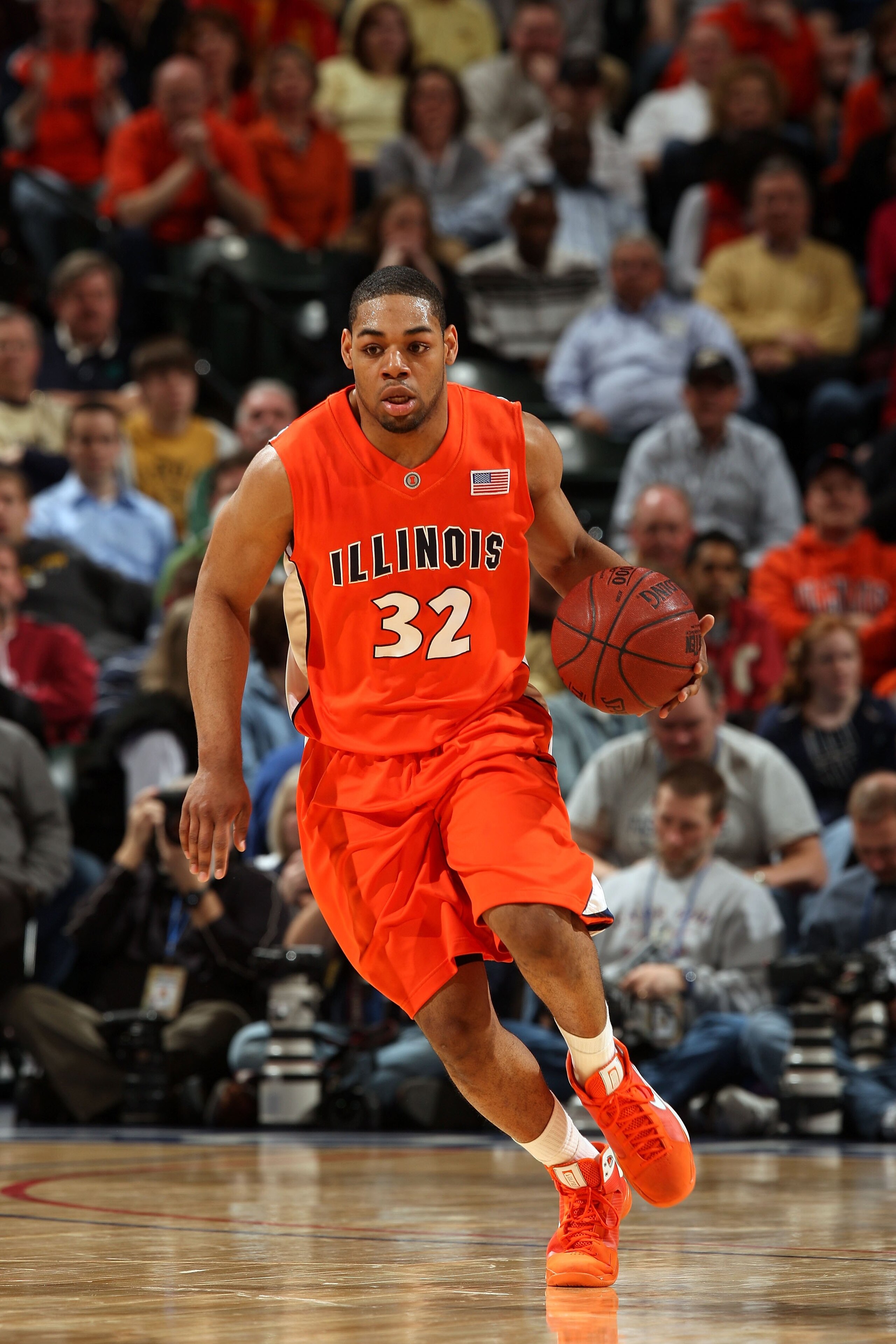 INDIANAPOLIS - MARCH 14:  Demetri McCamey #32 of the Illinois Fighting Illini brings the ball up court against the Purdue Boilermakers during their semifinal game of the Big Ten Men's Basketball Tournament at Conseco Fieldhouse on March 14, 2009 in Indian