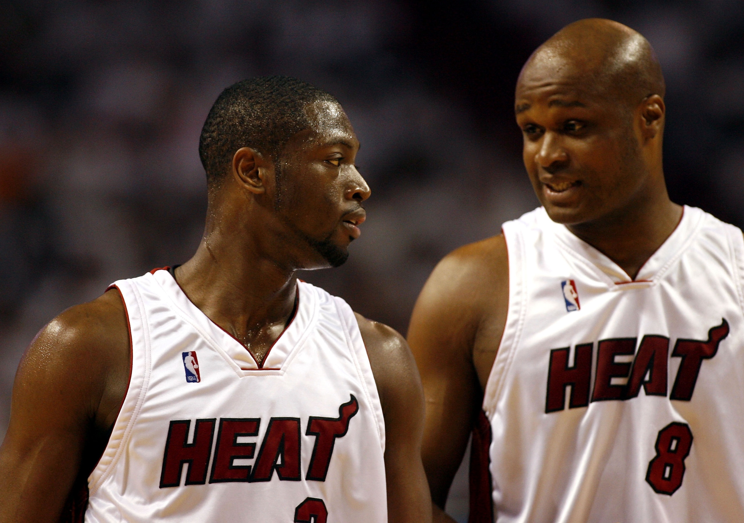 MIAMI - APRIL 29:  Forward Antoine Walker #8 of the Miami Heat chats with teammate Dwyane Wade #3 during a break in the action against the Chicago Bulls in Game Four of the Eastern Conference Quarterfinals during the 2007 NBA Playoffs on April 29, 2007 at