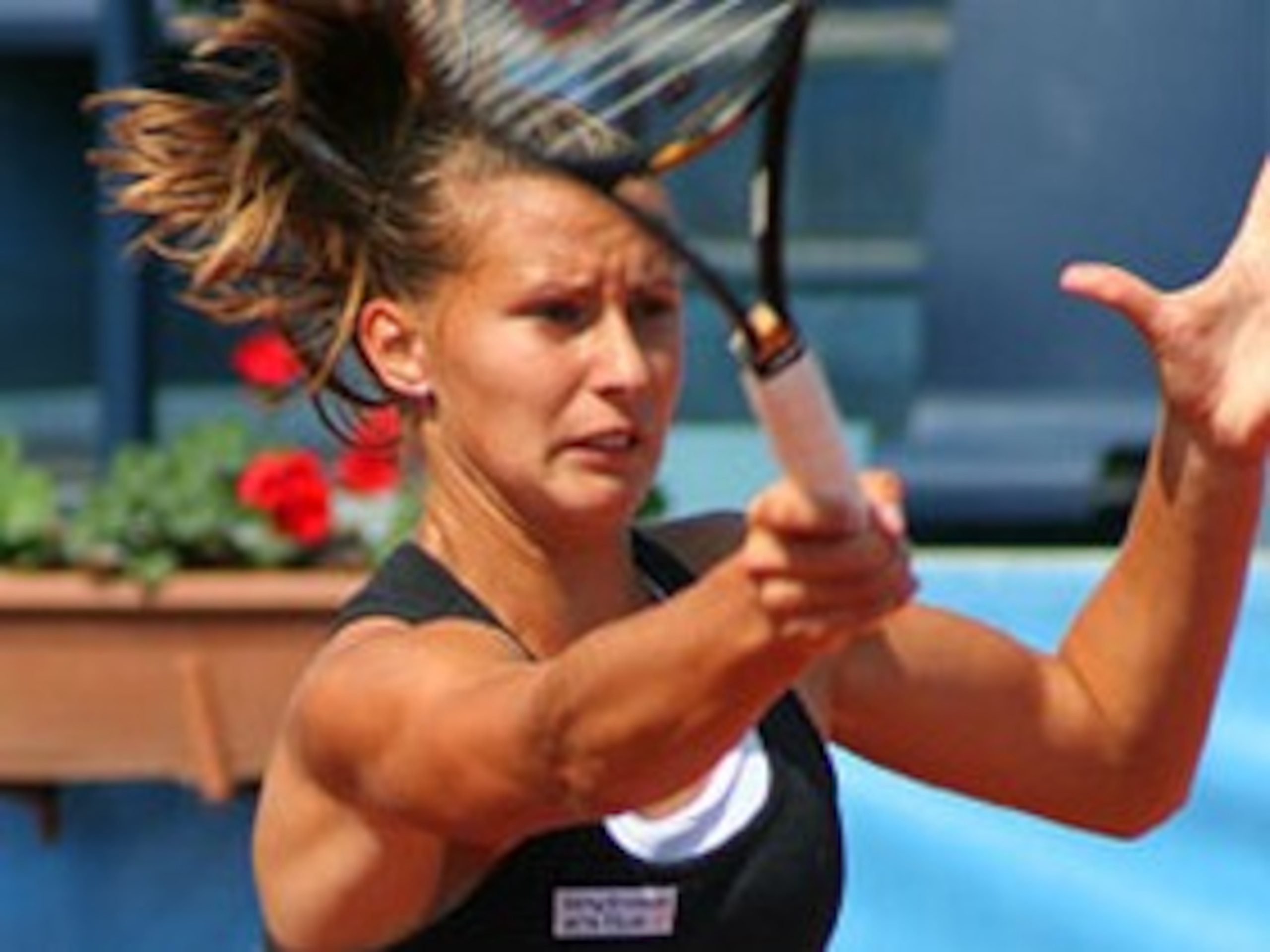 Hercog leans into her high-bouncing forehand.