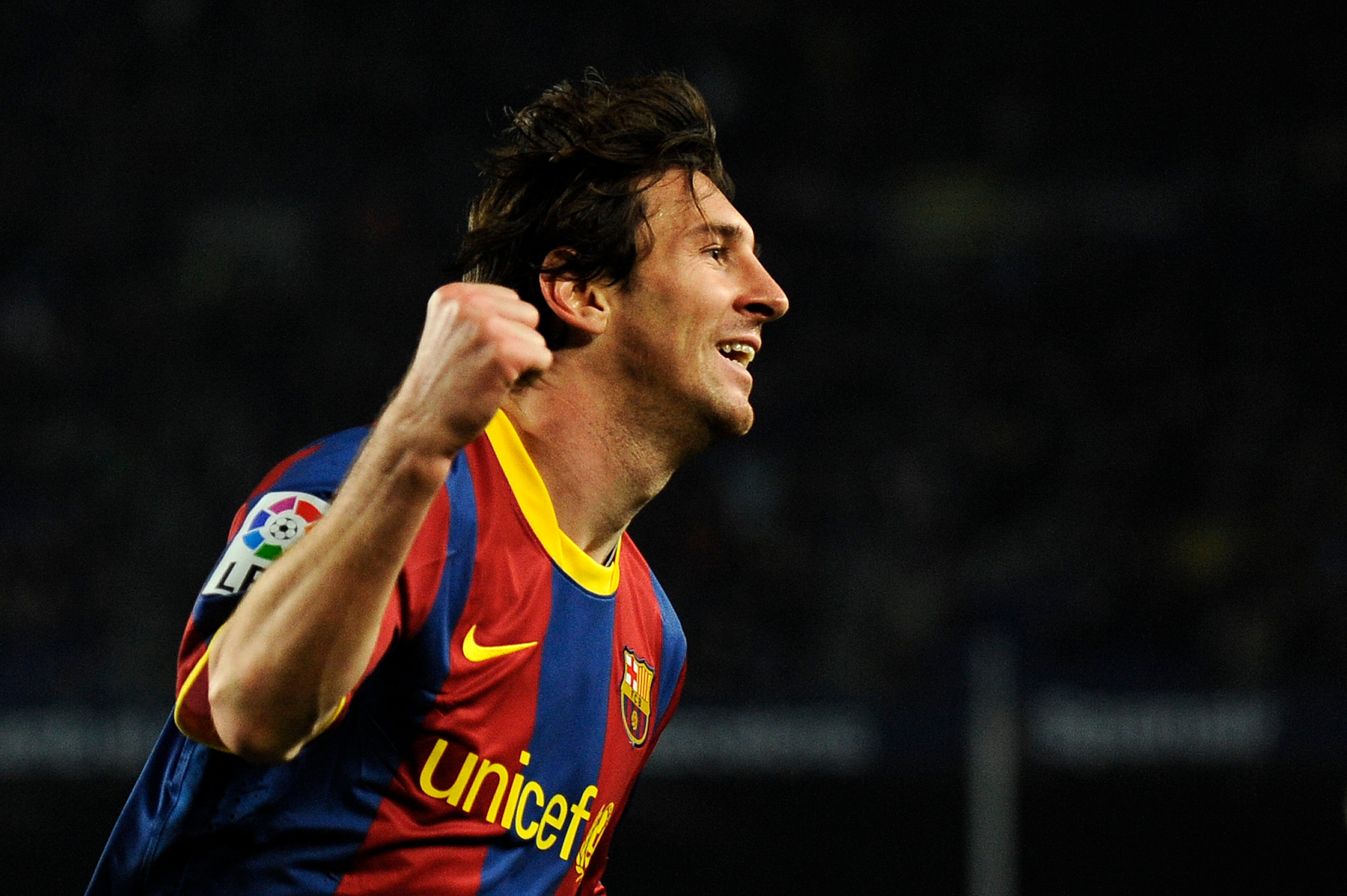 BARCELONA, SPAIN - JANUARY 12:  Lionel Messi of FC Barcelona (R) celebrates after scoring his side's second goal during the Copa del Rey quarter final first leg match FC Barcelona and Betis at Camp Nou on January 12, 2011 in Barcelona, Spain. Barcelona wo