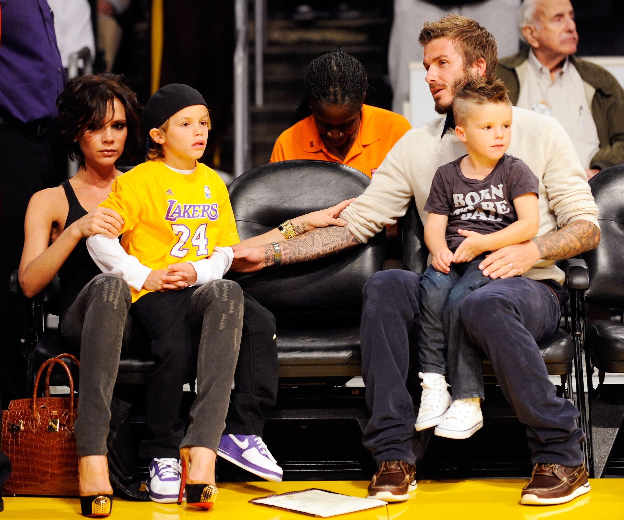 LOS ANGELES, CA - OCTOBER 30: David Beckham and his wife Victoria follow the action between the Los Angeles Lakers and the Dallas Mavericks along with their children Cruz (R) and Romeo (L) at Staples Center on October 30, 2009 in Los Angeles, California LOS ANGELES, CA - OCTOBER 30: David Beckham and his wife Victoria follow the action between the Los Angeles Lakers and the Dallas Mavericks along with their children Cruz (R) and Romeo (L) at Staples Center on October 30, 2009 in Los Angeles, California