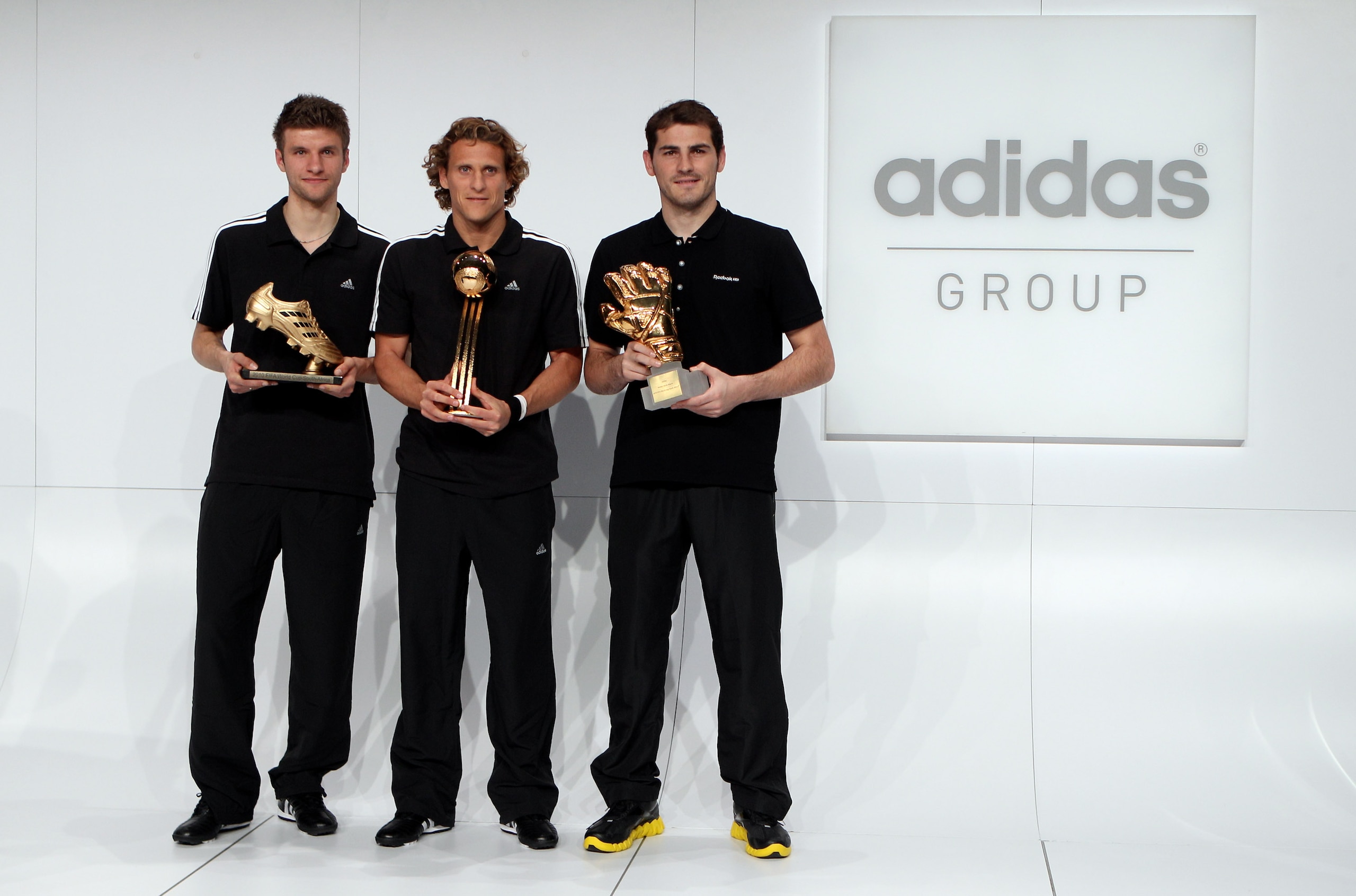 HERZOGENAURACH, GERMANY - DECEMBER 14: (L-R) Thomas Mueller, adidas Golden Boot Winner, Diego Forlan, adidas Golden Ball Winner and Iker Casillas, adidas Golden Glove Winner pose with their FIFA 2010 World Cup adidas Golden Awards during the award ceremo HERZOGENAURACH, GERMANY - DECEMBER 14: (L-R) Thomas Mueller, adidas Golden Boot Winner, Diego Forlan, adidas Golden Ball Winner and Iker Casillas, adidas Golden Glove Winner pose with their FIFA 2010 World Cup adidas Golden Awards during the award ceremo