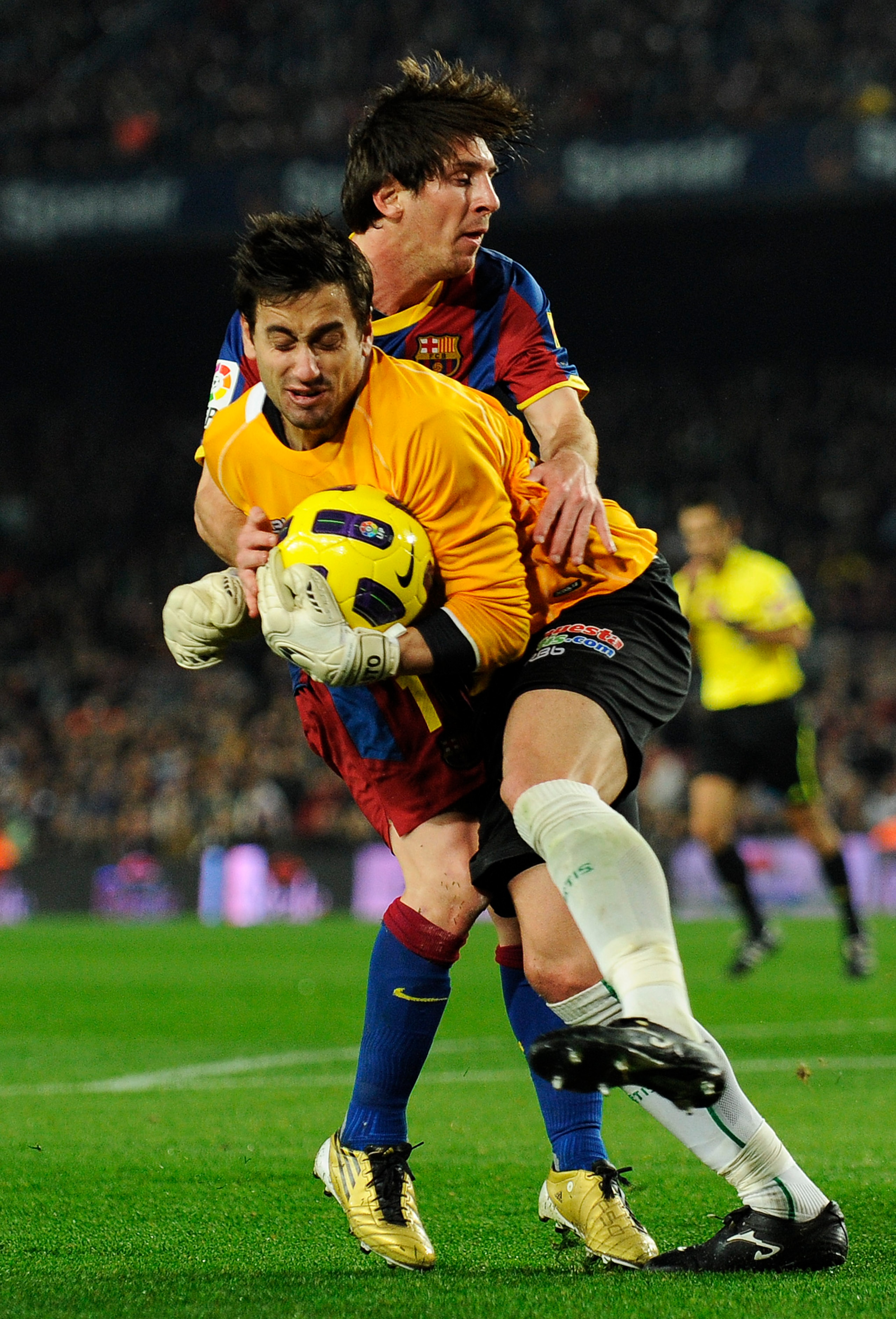 BARCELONA, SPAIN - JANUARY 12: Lionel Messi of FC Barcelona (L) duels for the ball agains Casto of Betis during the Copa del Rey quarter final first leg match FC Barcelona and Betis at Camp Nou on January 12, 2011 in Barcelona, Spain. Barcelona won 5-0. BARCELONA, SPAIN - JANUARY 12: Lionel Messi of FC Barcelona (L) duels for the ball agains Casto of Betis during the Copa del Rey quarter final first leg match FC Barcelona and Betis at Camp Nou on January 12, 2011 in Barcelona, Spain. Barcelona won 5-0.