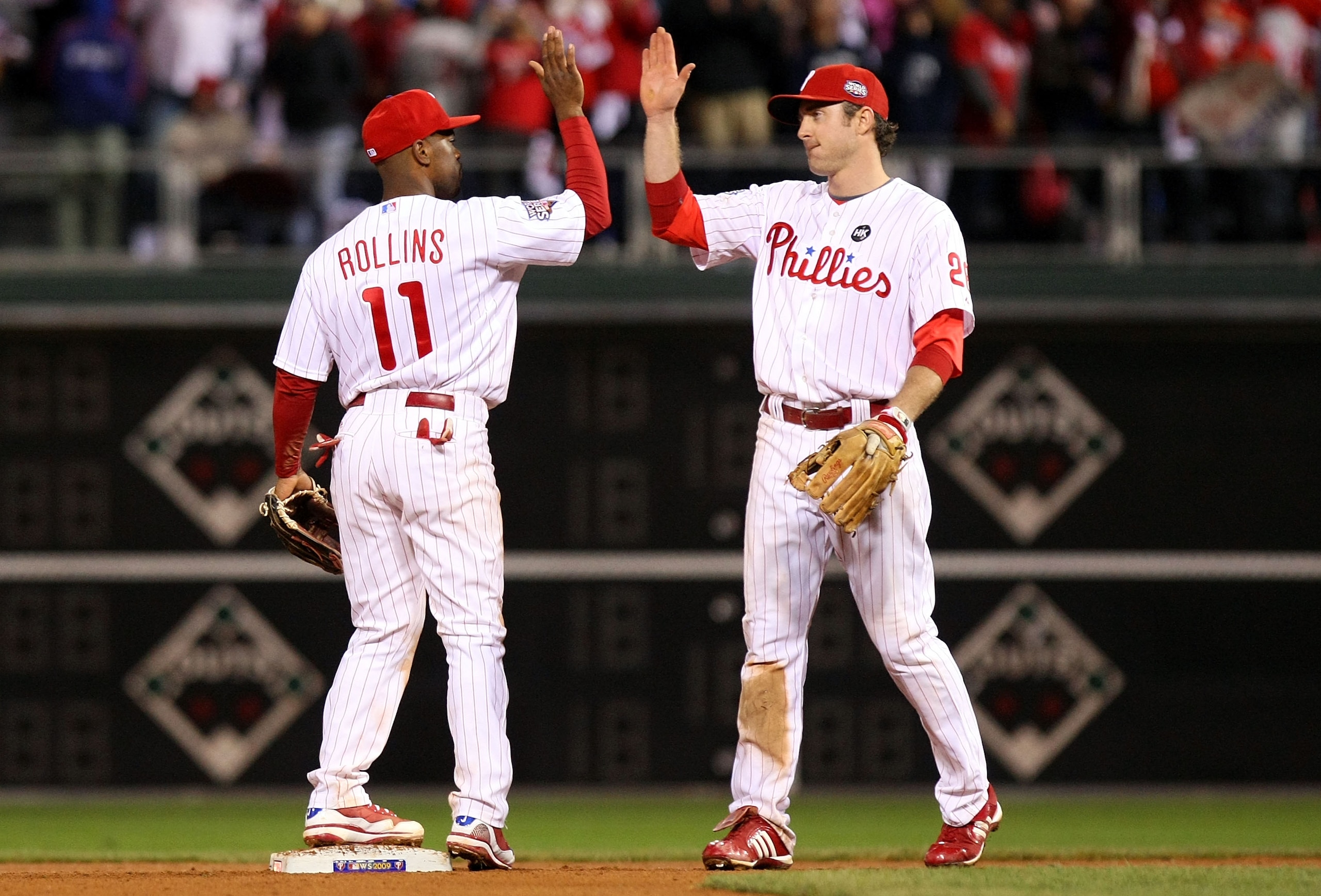 PHILADELPHIA - NOVEMBER 02:  (L-R) Jimmy Rollins #11 and Chase Utley #26 of the Philadelphia Phillies celebrate their 8-6 win against the New York Yankees in Game Five of the 2009 MLB World Series at Citizens Bank Park on November 2, 2009 in Philadelphia,