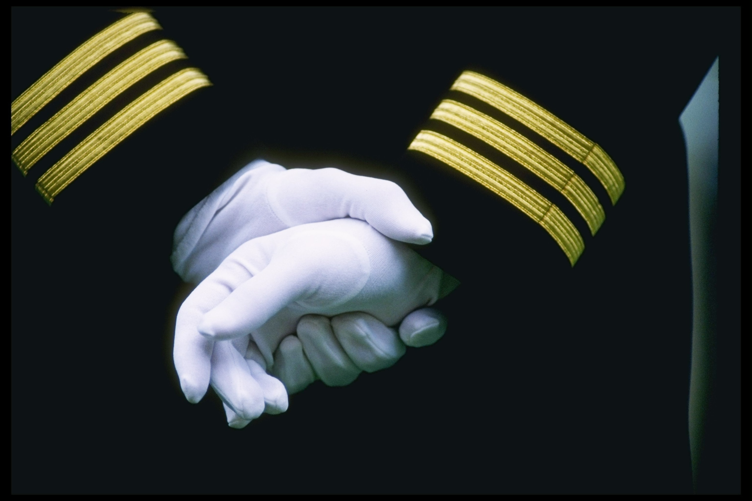 3 Dec 1994: View of two Navy recruits holding hands during a game between the Army Black Knights and the Navy Midshippmen at Veterans Stadium in Philadelphia, Pennsylvania. Army won the game 22-20.