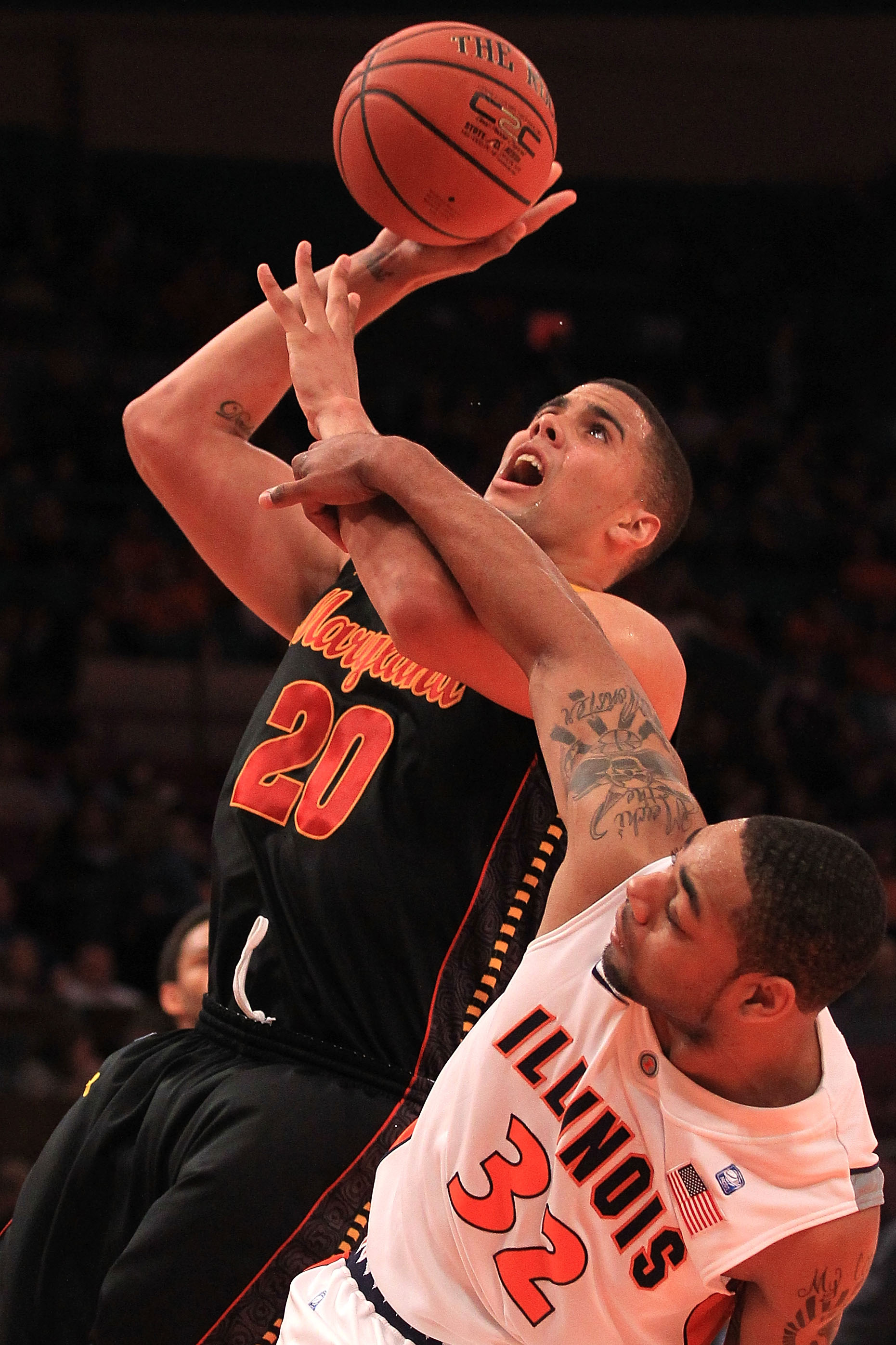 NEW YORK - NOVEMBER 19:  Jordan Williams #20 of the Maryland Terrapins is fouled by Demetri McCamey #32 of the Illinois Fighting Illini during the 2k Sports Classic at Madison Square Garden on November 19, 2010 in New York, New York.  (Photo by Chris McGr
