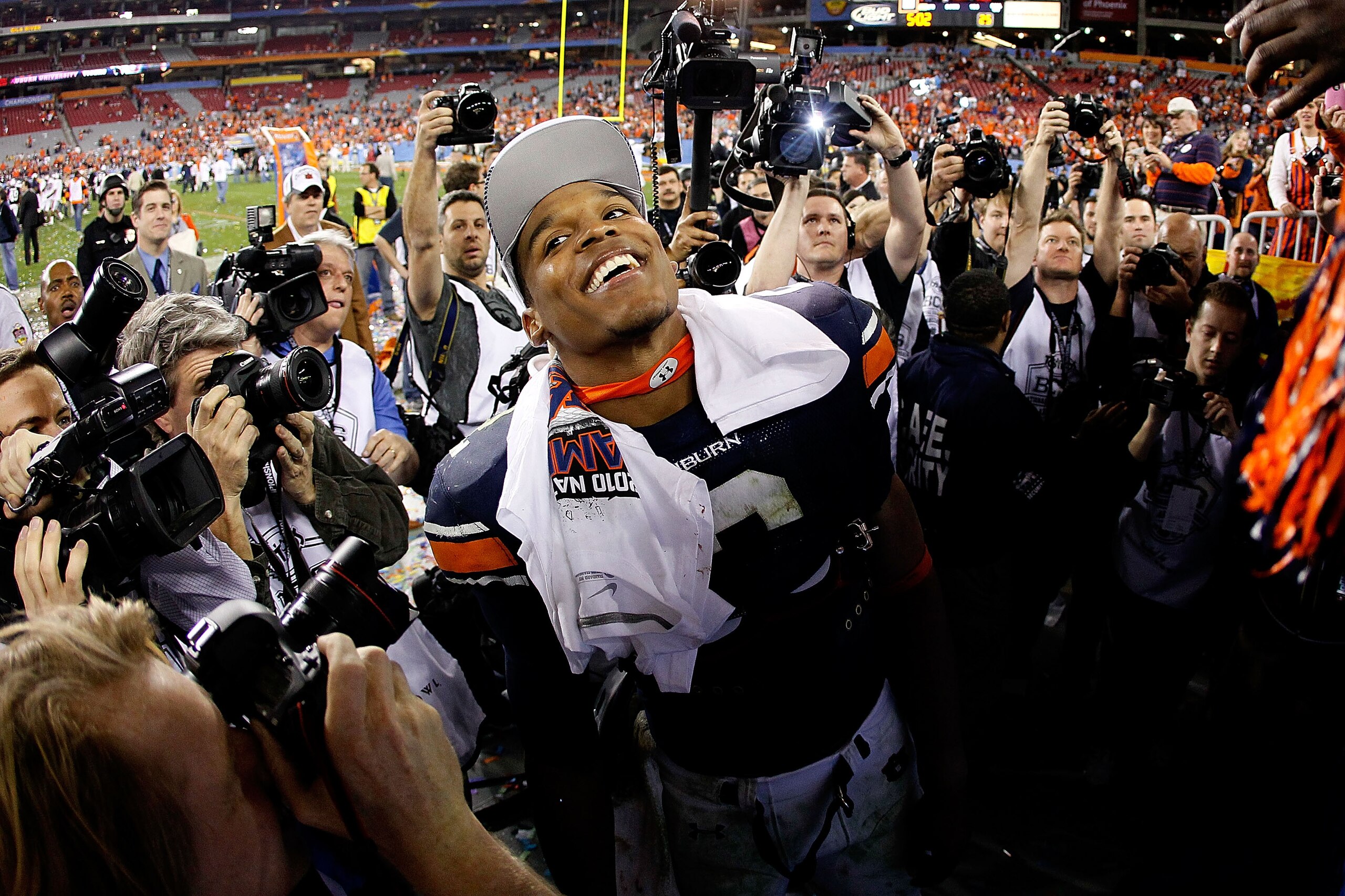 GLENDALE, AZ - JANUARY 10: Quarterback Cameron Newton #2 of the Auburn Tigers celebrates the Tigers 22-19 victory with the fans after defeating the Oregon Ducks in the Tostitos BCS National Championship Game at University of Phoenix Stadium on January 10 GLENDALE, AZ - JANUARY 10: Quarterback Cameron Newton #2 of the Auburn Tigers celebrates the Tigers 22-19 victory with the fans after defeating the Oregon Ducks in the Tostitos BCS National Championship Game at University of Phoenix Stadium on January 10