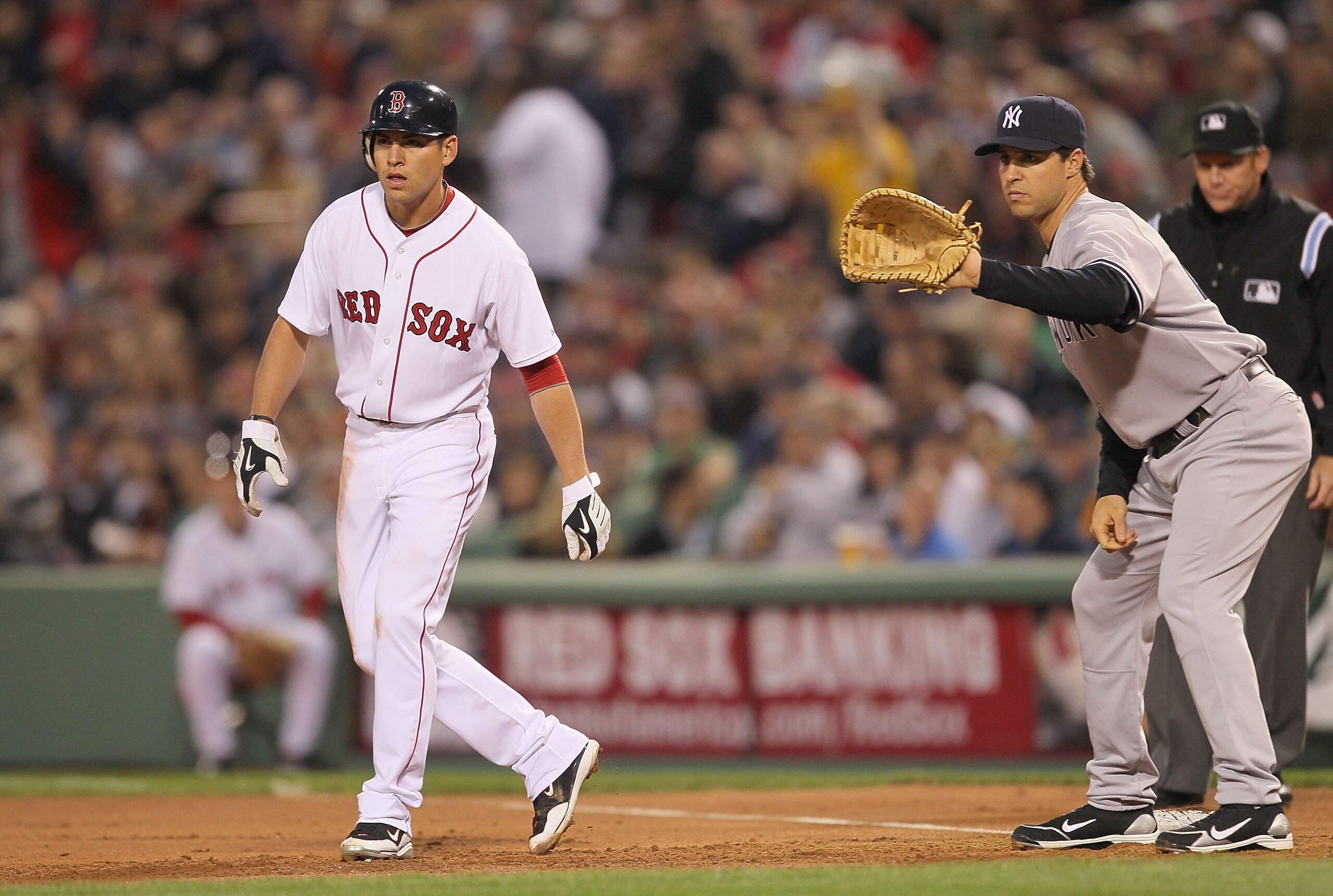 BOSTON - APRIL 06:  Jacoby Ellsbury #2 leads away from Mark Teixeira #25 of the New York Yankees at Fenway Park on April 6, 2010 in Boston, Massachusetts. (Photo by Jim Rogash/Getty Images)