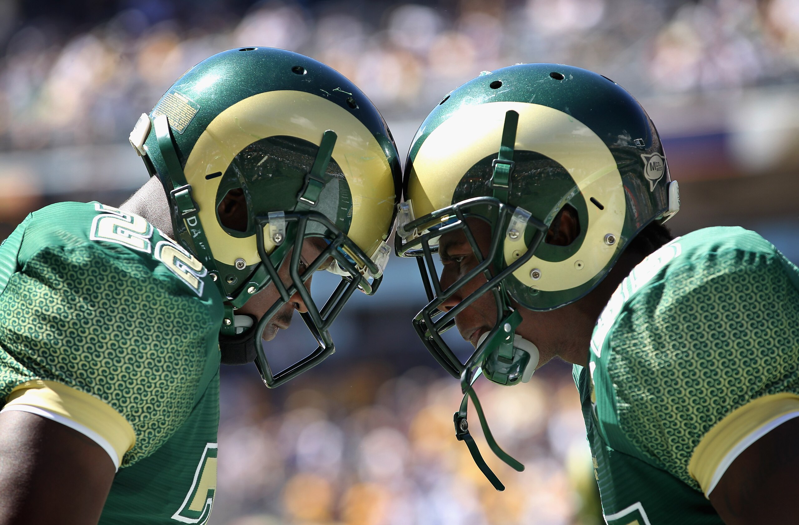 DENVER - SEPTEMBER 04:  (L-R) Elijah-Blu Smith #22 and Ivory Herd #35 of the Colorado State Rams prepare to face the Colorado Buffaloes during the the Rocky Mountain Showdown at INVESCO Field at Mile High on September 4, 2010 in Denver, Colorado. Colorado