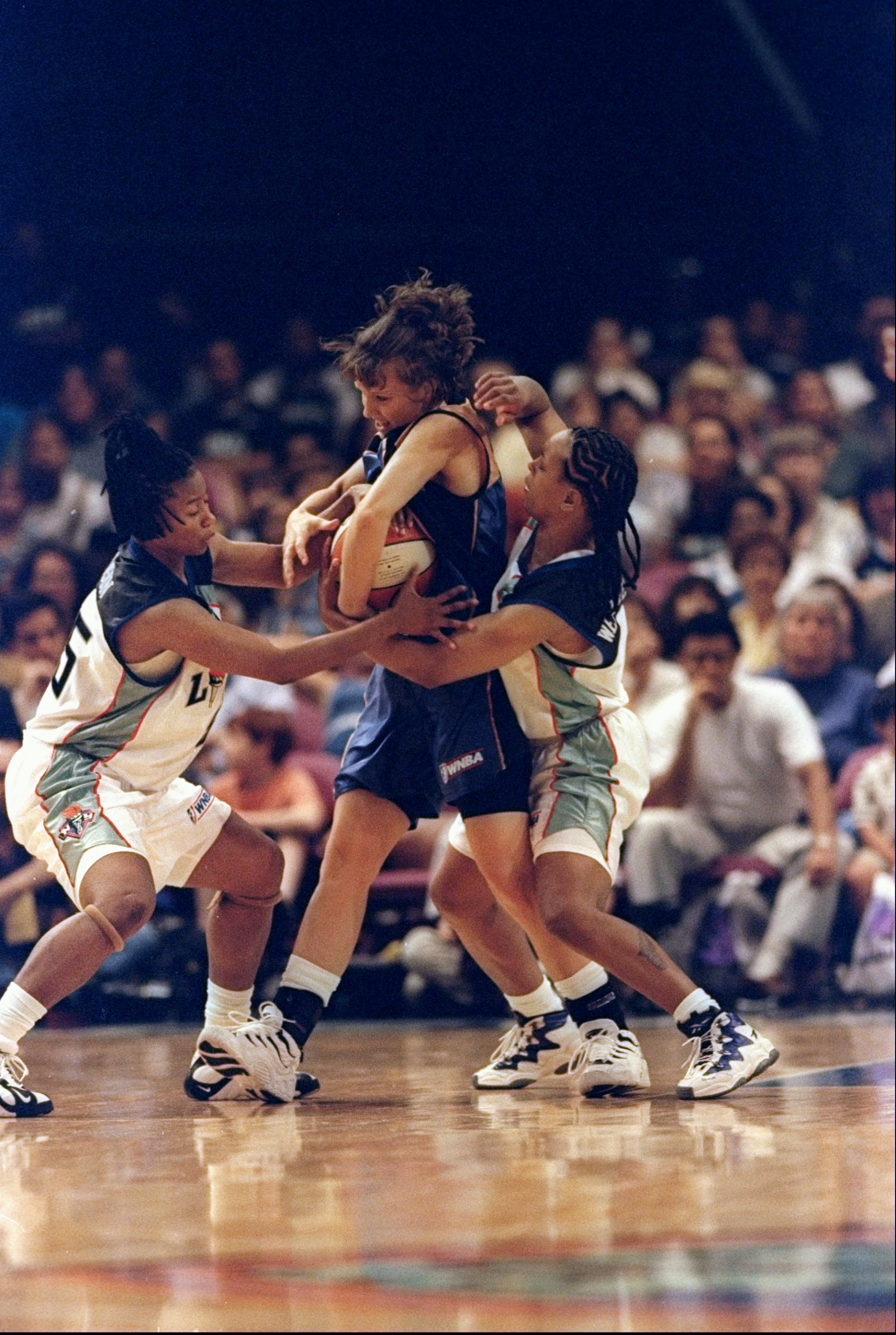 31 May 1998: Vickie Johnson #55 of the Washington Mysticsstruggles to keep the ball from Keri Chaconas and Teresa Weatherspoon of the New York Liberty during a preseason game at Madison Square Garden in New York, New York. the Mystics defeated the Liberty