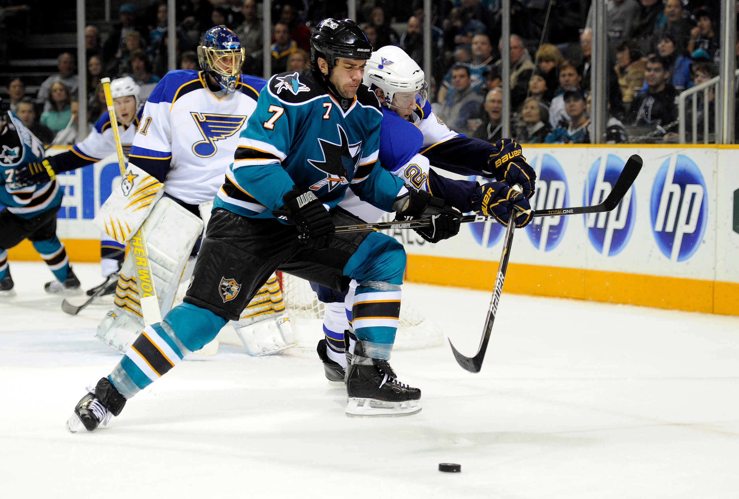 SAN JOSE, CA - JANUARY 15: Niclas Wallin #7 of the San Jose Sharks battles the puck away from Brad Boyes #22 of the St. Louis Blues in the second period of an NHL hockey game at the HP Pavilion on January 15, 2011 in San Jose, California. (Photo by Thear SAN JOSE, CA - JANUARY 15: Niclas Wallin #7 of the San Jose Sharks battles the puck away from Brad Boyes #22 of the St. Louis Blues in the second period of an NHL hockey game at the HP Pavilion on January 15, 2011 in San Jose, California. (Photo by Thear