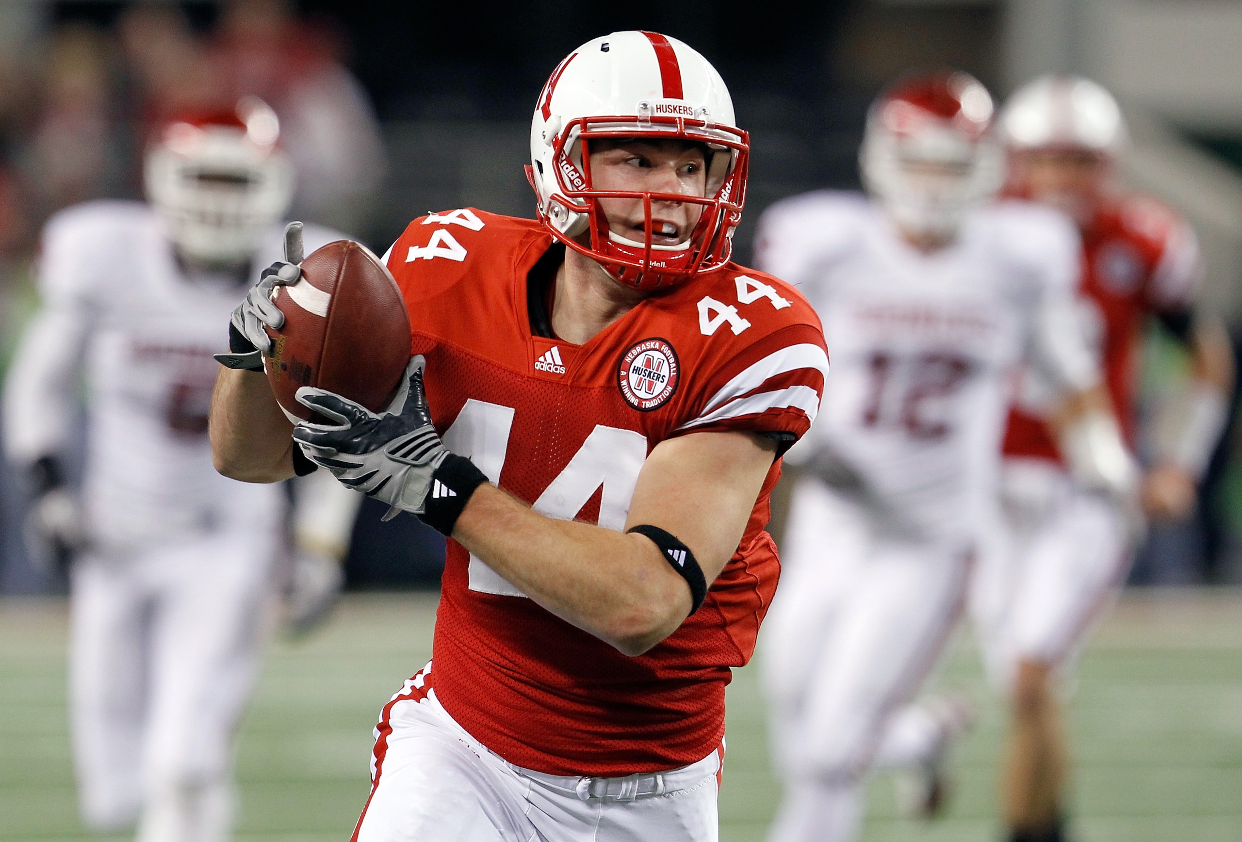 ARLINGTON, TX - DECEMBER 04:  Wide receiver Mike McNeil #44 of the Nebraska Cornhuskers pulls in a pass against the Oklahoma Sooners at Cowboys Stadium on December 4, 2010 in Arlington, Texas.  The Sooners beat the Cornhuskers 23-20.  (Photo by Tom Pennin