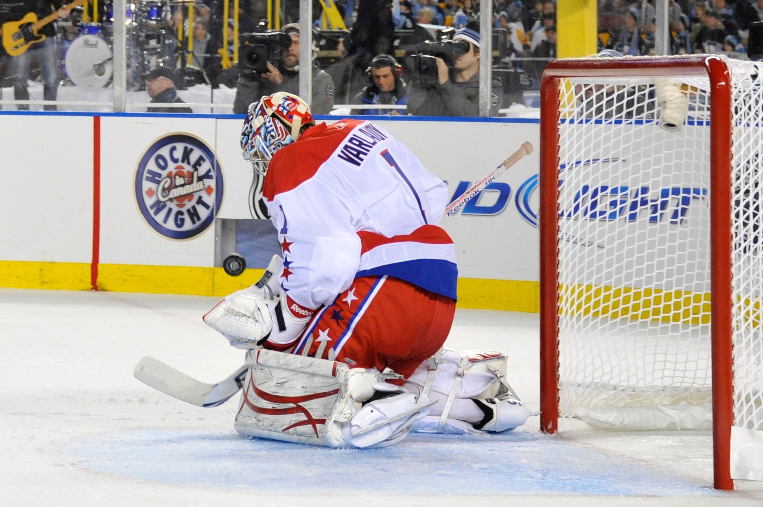 PITTSBURGH, PA - JANUARY 01:  Semyon Varlamov #1 of the Washington Capitals defends the net against a shot by the Pittsburgh Penguins during the 2011 NHL Bridgestone Winter Classic at Heinz Field on January 1, 2011 in Pittsburgh, Pennsylvania. Washington
