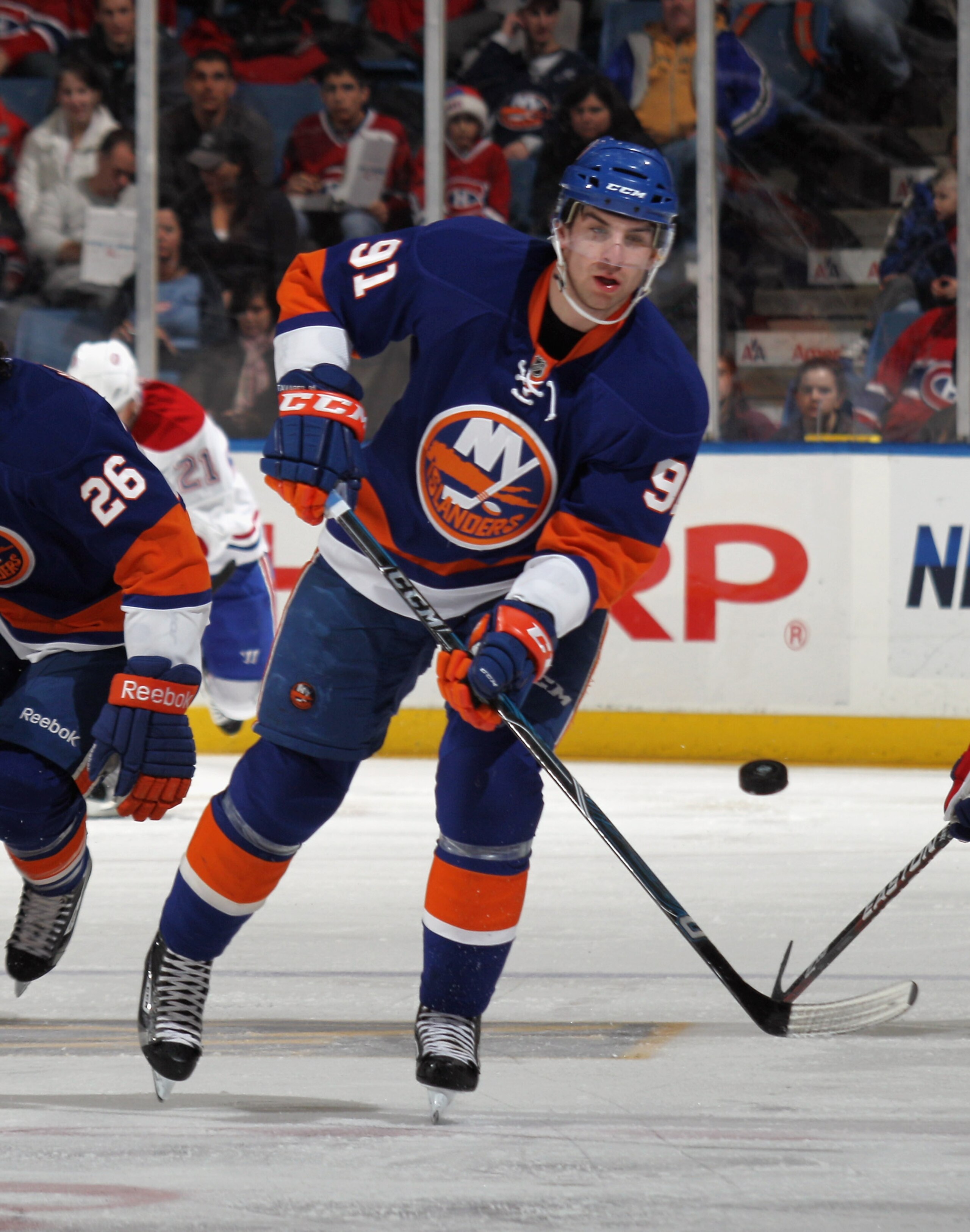 UNIONDALE, NY - DECEMBER 26:  John Tavares #91 of the New York Islanders skates against the Montreal Canadiens at the Nassau Coliseum on December 26, 2010 in Uniondale, New York. The Islanders defeated the Canadiens 4-1.  (Photo by Bruce Bennett/Getty Ima