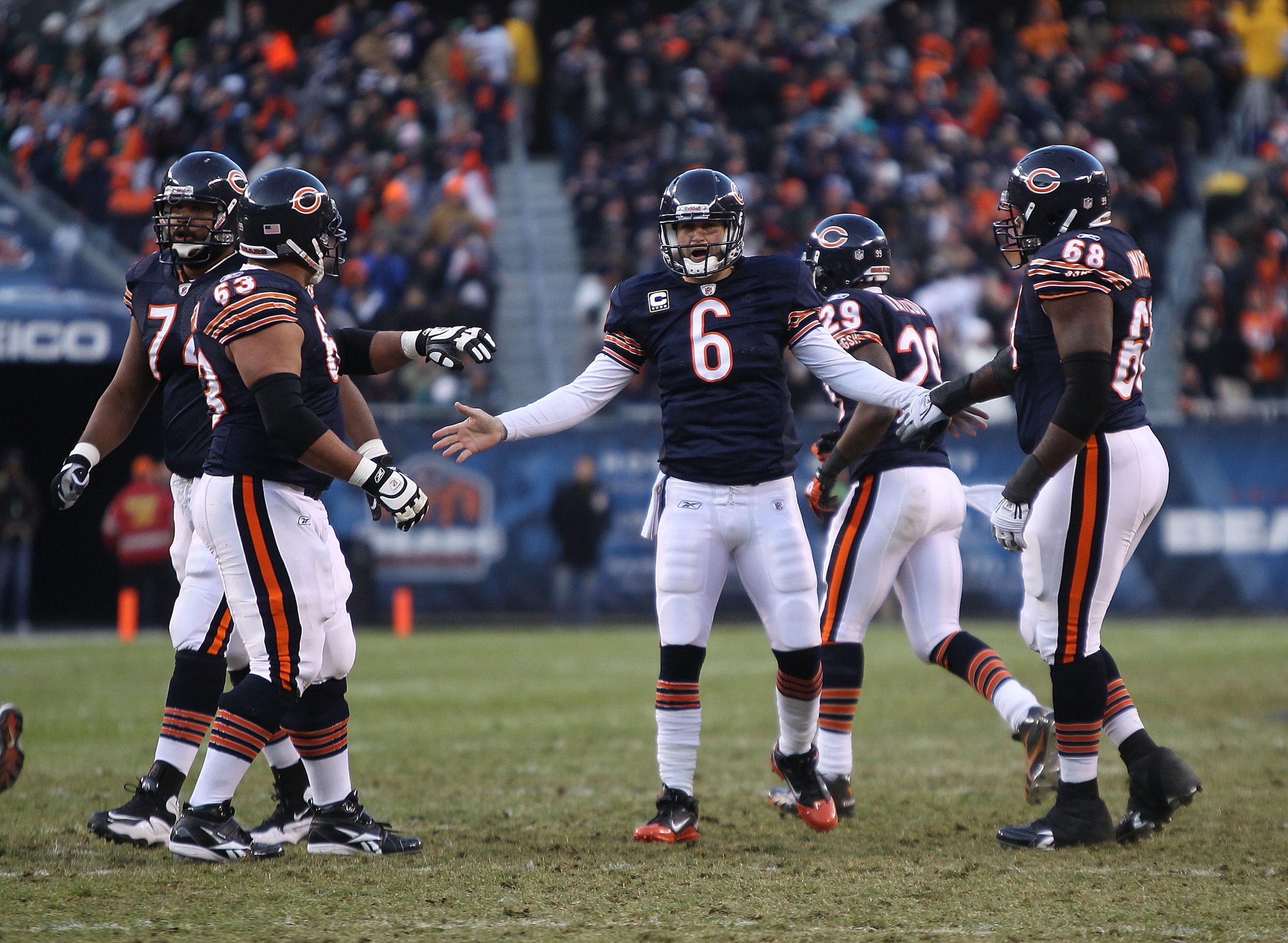 CHICAGO - NOVEMBER 28: Jay Cutler #6 of the Chicago Bears congratulates teammates (L-R) Chris Williams #74, Roberto Garza #63 and Frank Omiyale #68 after a touchdown throw against the Philadelphia Eagles at Soldier Field on November 28, 2010 in Chicago, I