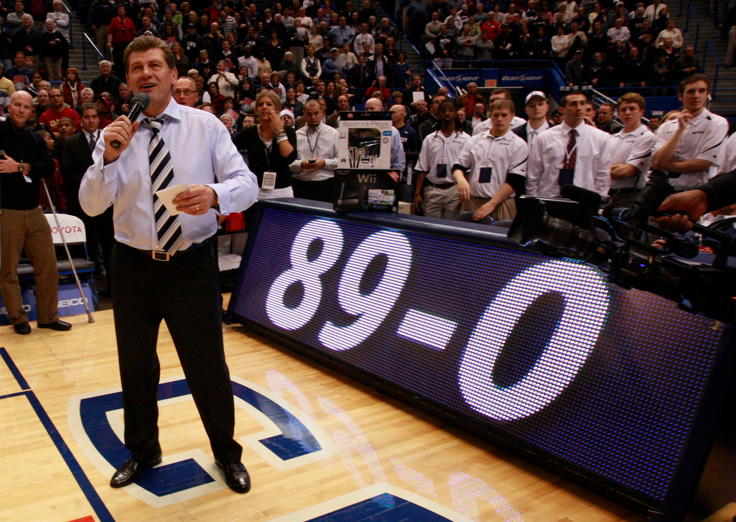 HARTFORD, CT - DECEMBER 21:  Coach Geno Auriemma of Connecticut celebrates a win over  Florida State on December 21, 2010 in Hartford, Connecticut.  Connecticut set a record with 89 straight wins without a defeat. (Photo by Jim Rogash/Getty Images)
