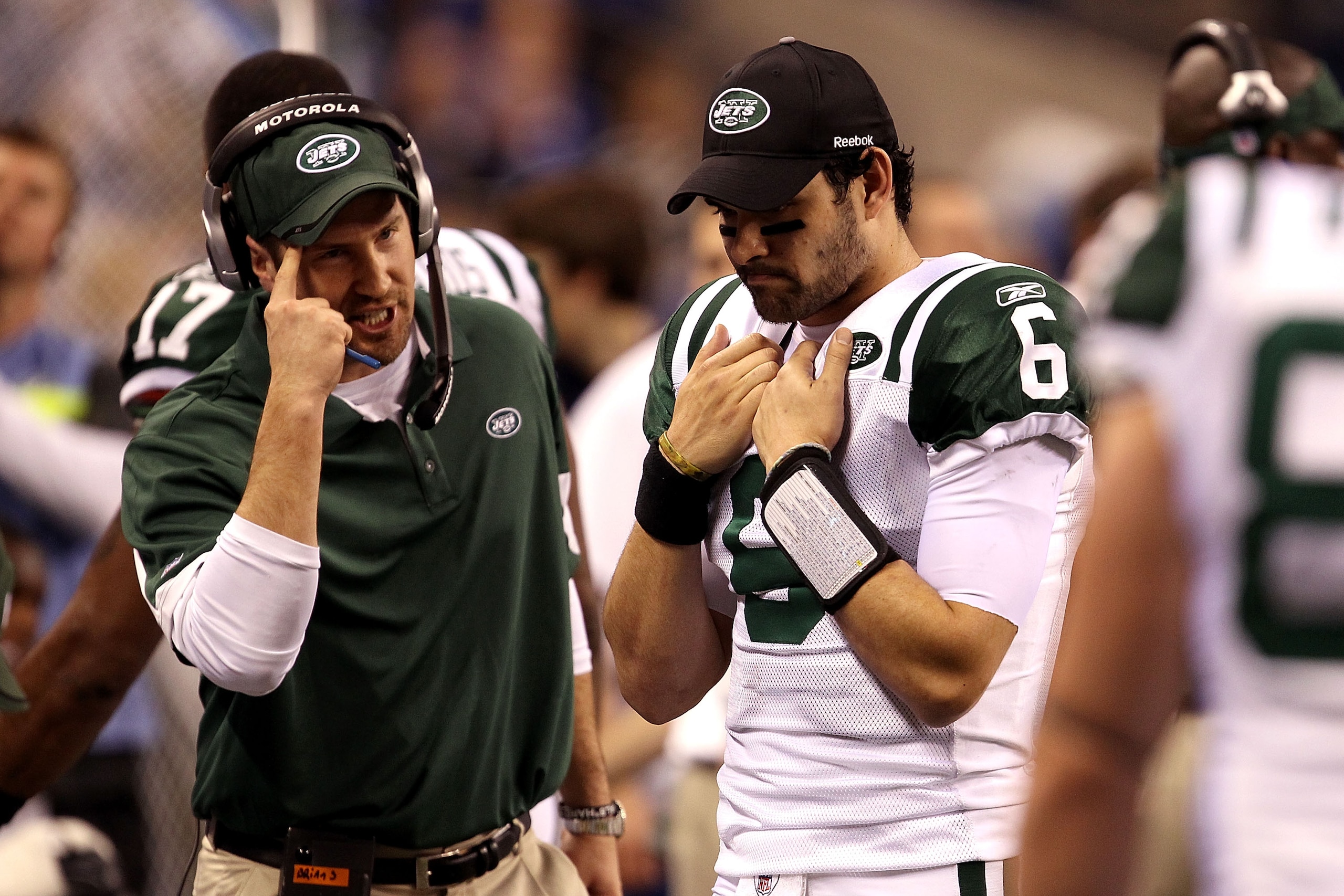 INDIANAPOLIS, IN - JANUARY 08:  Offensive coordinator Brian Schottenheimer of the New York Jets gestures as he talks to quarterback Mark Sanchez #6 late in the fourth quarter against the Indianapolis Colts during their 2011 AFC wild card playoff game at L