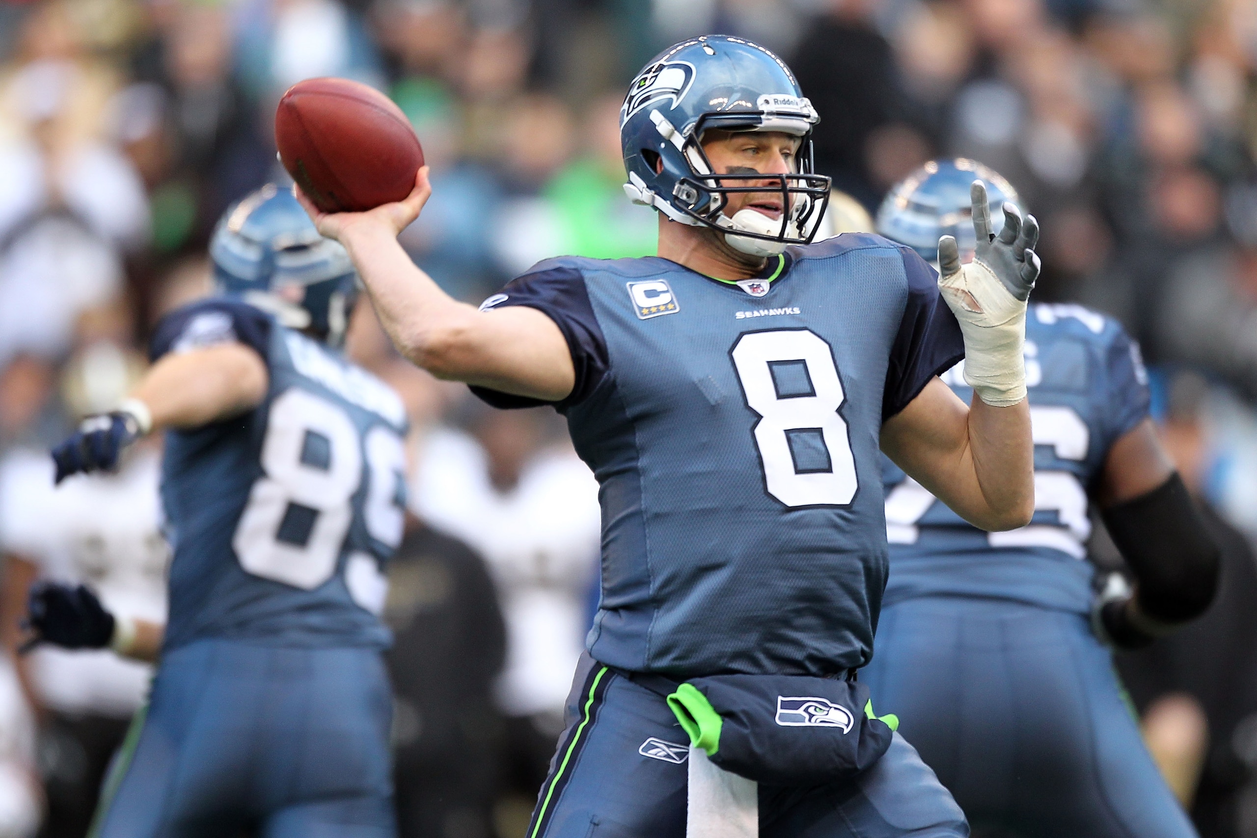 SEATTLE, WA - JANUARY 08:  Quarterback Matt Hasselbeck #8 of the Seattle Seahawks throws the ball in the first half against the New Orleans Saints during the 2011 NFC wild-card playoff game at Qwest Field on January 8, 2011 in Seattle, Washington.  (Photo