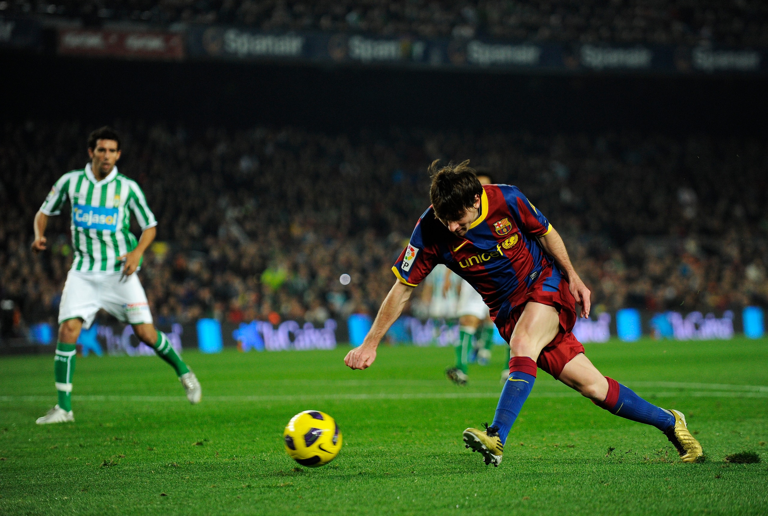 BARCELONA, SPAIN - JANUARY 12: Lionel Messi of FC Barcelona scores his side's second goal during the Copa del Rey quarter final first leg match FC Barcelona and Betis at Camp Nou on January 12, 2011 in Barcelona, Spain. Barcelona won 5-0. (Photo by Davi BARCELONA, SPAIN - JANUARY 12: Lionel Messi of FC Barcelona scores his side's second goal during the Copa del Rey quarter final first leg match FC Barcelona and Betis at Camp Nou on January 12, 2011 in Barcelona, Spain. Barcelona won 5-0. (Photo by Davi