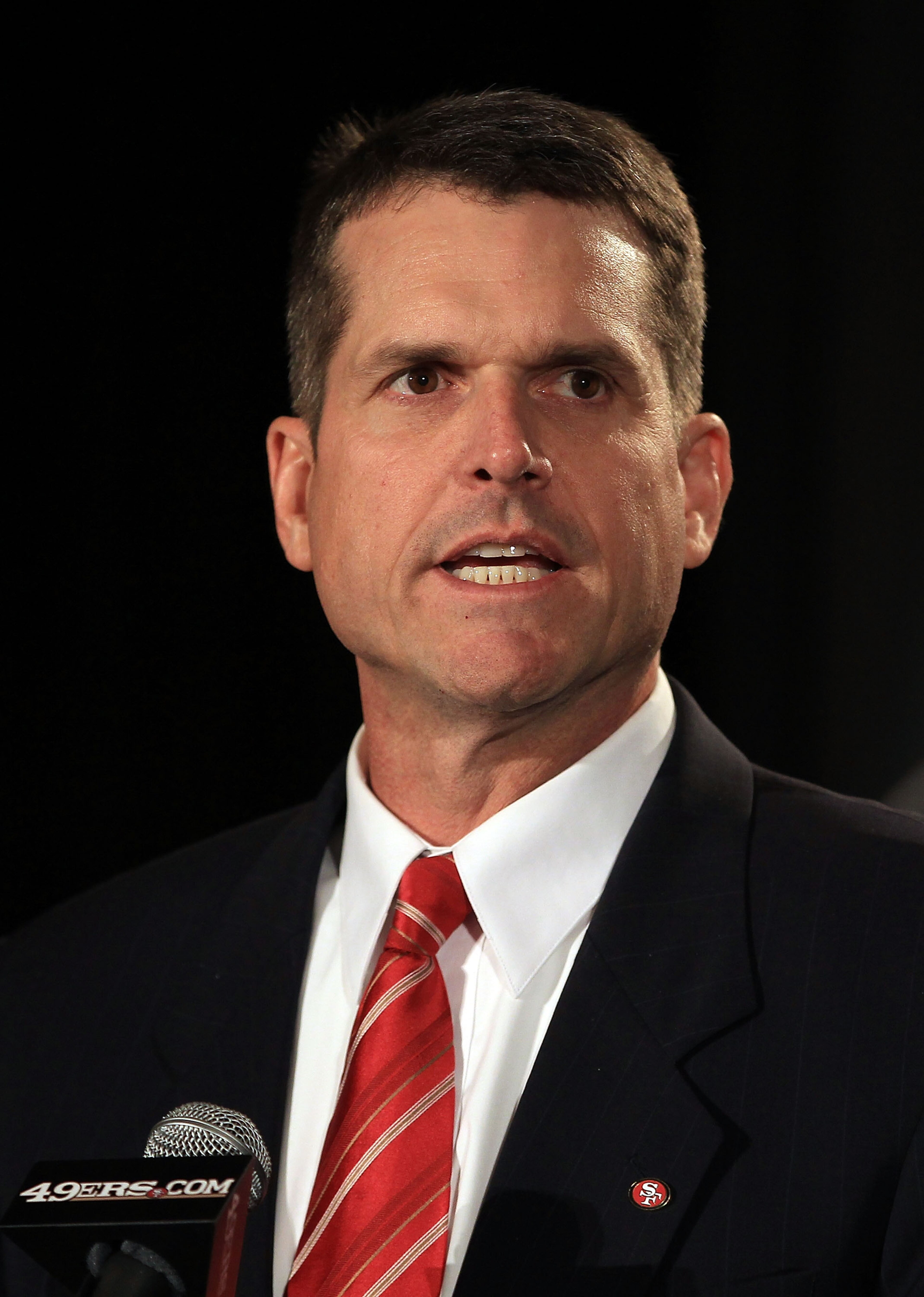 SAN FRANCISCO, CA - JANUARY 07: Jim Harbaugh speaks at a press conference where he was introduced as the new San Francisco 49ers head coach at the Palace Hotel on January 7, 2011 in San Francisco, California. (Photo by Ezra Shaw/Getty Images) SAN FRANCISCO, CA - JANUARY 07: Jim Harbaugh speaks at a press conference where he was introduced as the new San Francisco 49ers head coach at the Palace Hotel on January 7, 2011 in San Francisco, California. (Photo by Ezra Shaw/Getty Images)