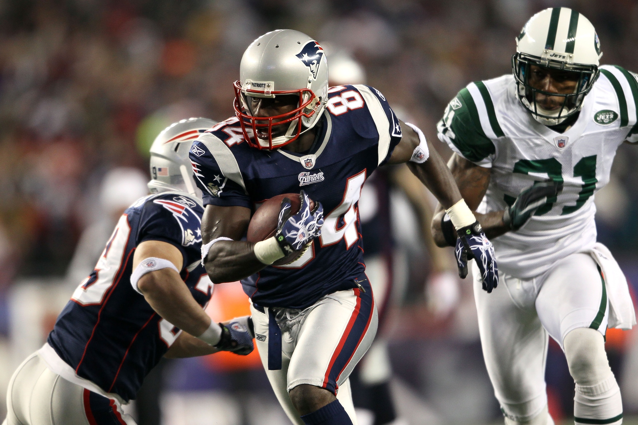 FOXBORO, MA - DECEMBER 06: Deion Branch #84 of the New England Patriots scores on a 25-yard touchdown reception in the first quarter against Antonio Cromartie #31 of the New York Jets at Gillette Stadium on December 6, 2010 in Foxboro, Massachusetts. (P FOXBORO, MA - DECEMBER 06: Deion Branch #84 of the New England Patriots scores on a 25-yard touchdown reception in the first quarter against Antonio Cromartie #31 of the New York Jets at Gillette Stadium on December 6, 2010 in Foxboro, Massachusetts. (P