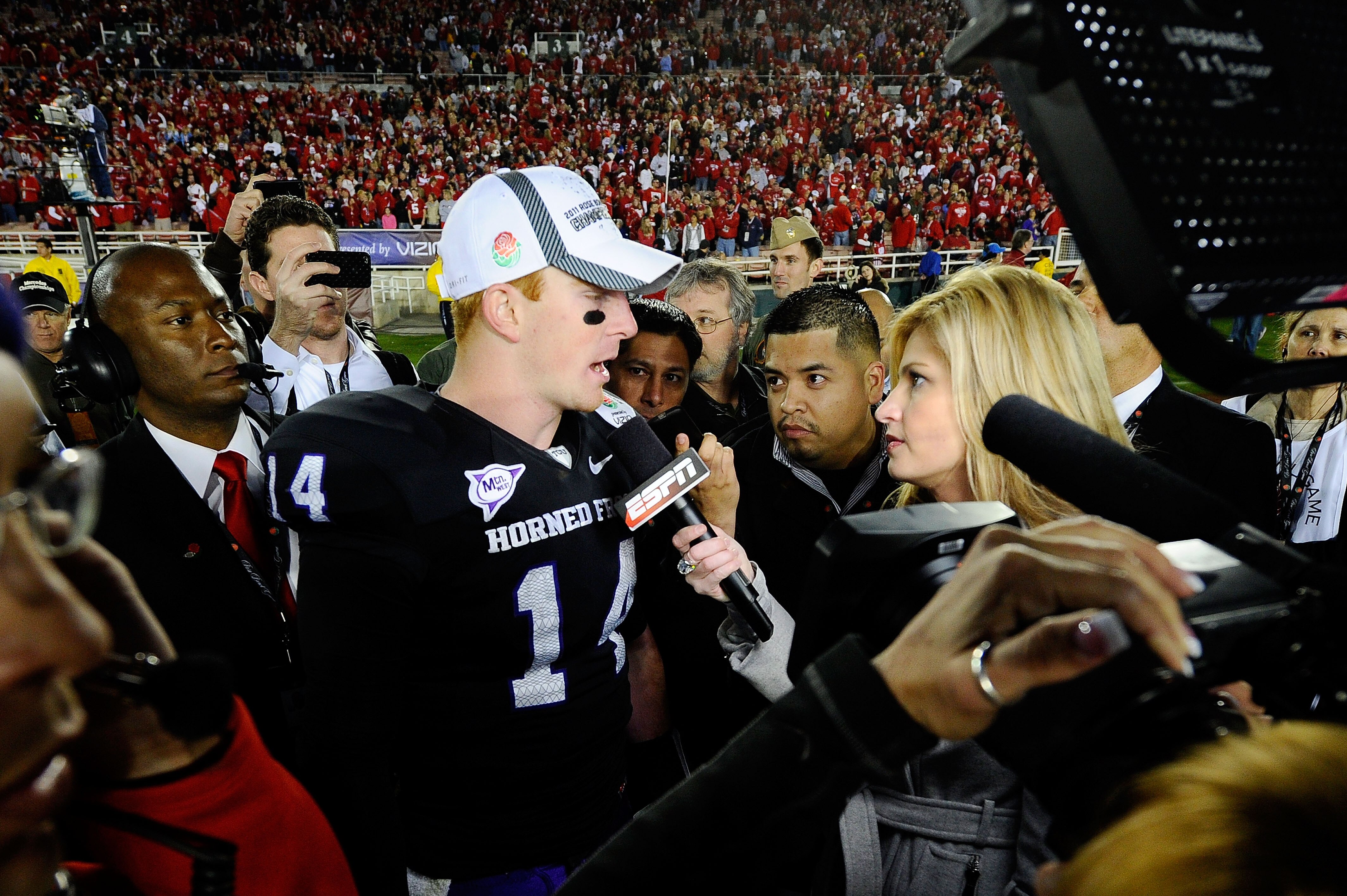 PASADENA, CA - JANUARY 01:  Quarterback Andy Dalton #14 of the TCU Horned Frogs is interviewed by reporter Erin Andrews after defeating the Wisconsin Badgers 21-19 in the 97th Rose Bowl game on January 1, 2011 in Pasadena, California.  (Photo by Kevork Dj