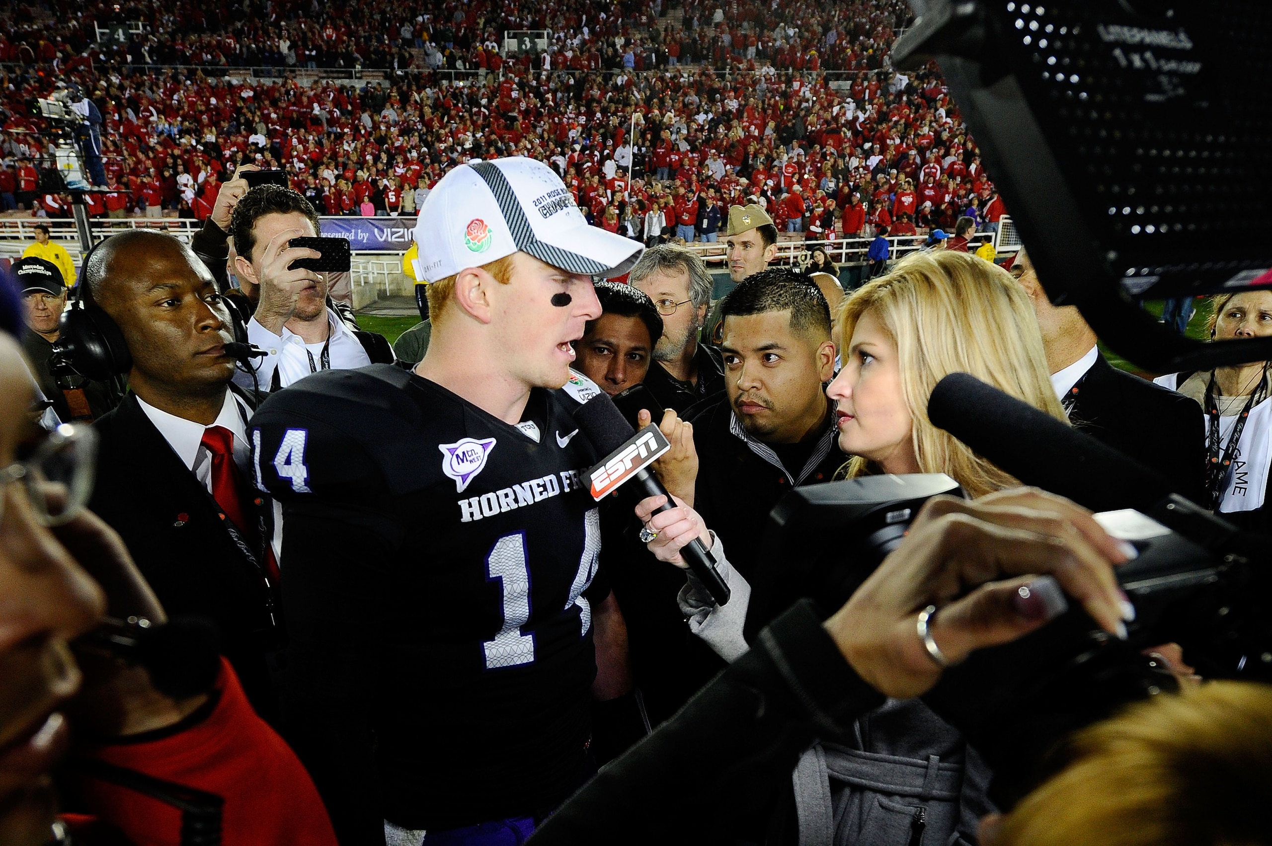 PASADENA, CA - JANUARY 01:  Quarterback Andy Dalton #14 of the TCU Horned Frogs is interviewed by reporter Erin Andrews after defeating the Wisconsin Badgers 21-19 in the 97th Rose Bowl game on January 1, 2011 in Pasadena, California.  (Photo by Kevork Dj