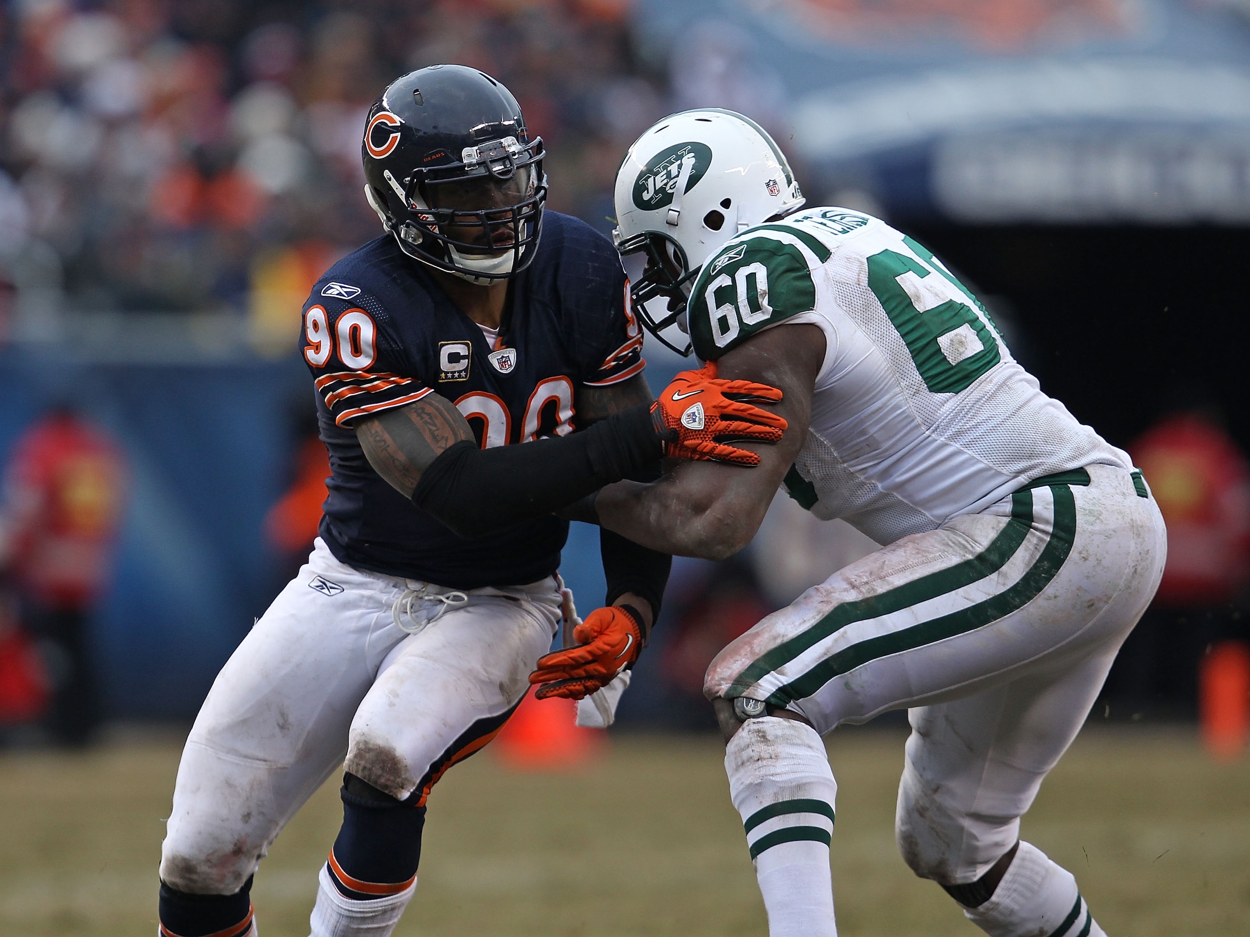CHICAGO, IL - DECEMBER 26: Julius Peppers #90 of the Chicago Bears rushes against D' Brickashaw Ferguson #60 of the New York Jets at Soldier Field on December 26, 2010 in Chicago, Illinois. The Bears defeated the Jets 38-34. (Photo by Jonathan Daniel/Gett