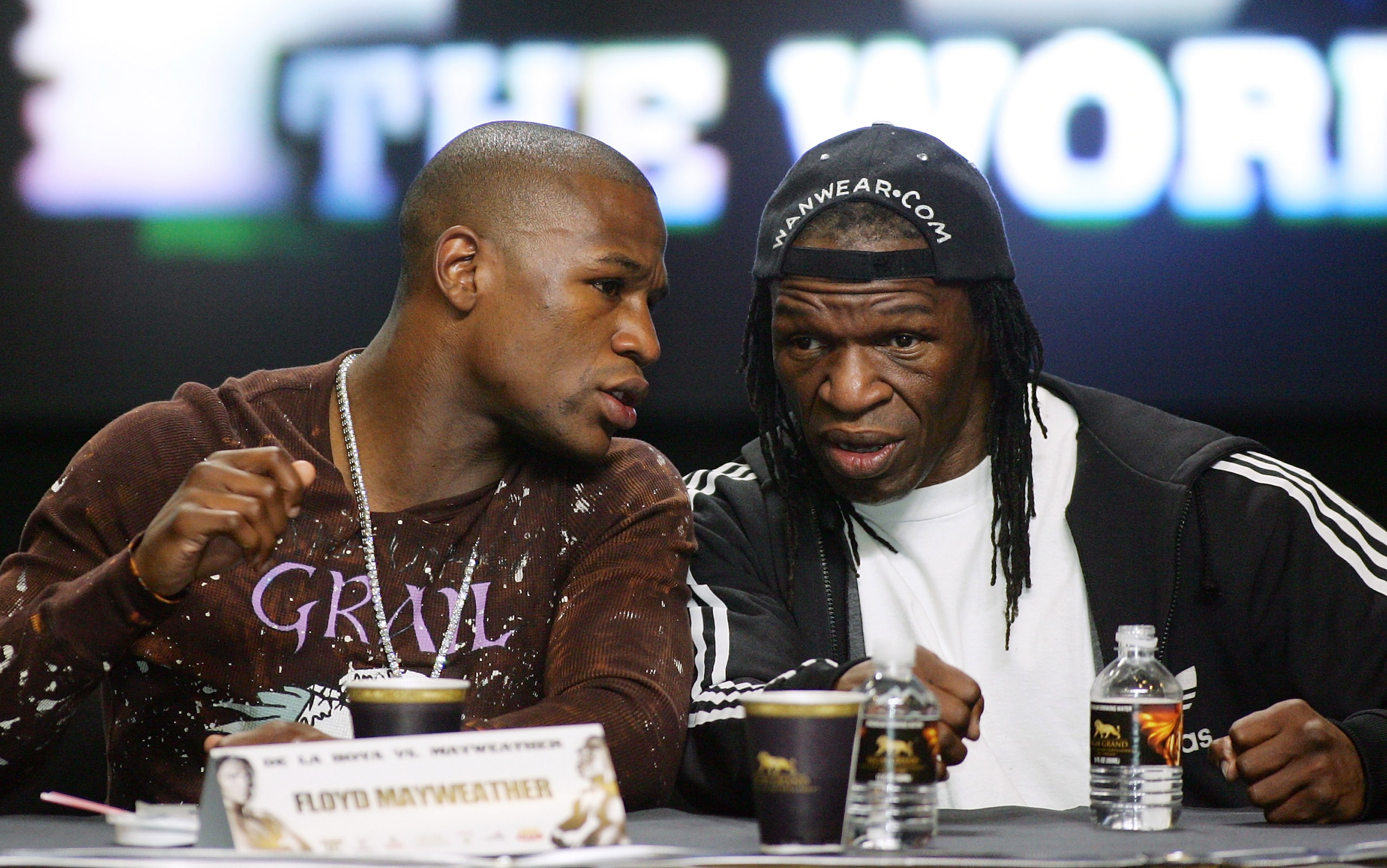 LAS VEGAS - FEBRUARY 27:  Boxer Floyd Mayweather Jr. (L) talks to his father and trainer Floyd Mayweather Sr. during a news conference at the MGM Grand Hotel/Casino as part of a media tour announcing his fight with Oscar De La Hoya February 27, 2007 in La