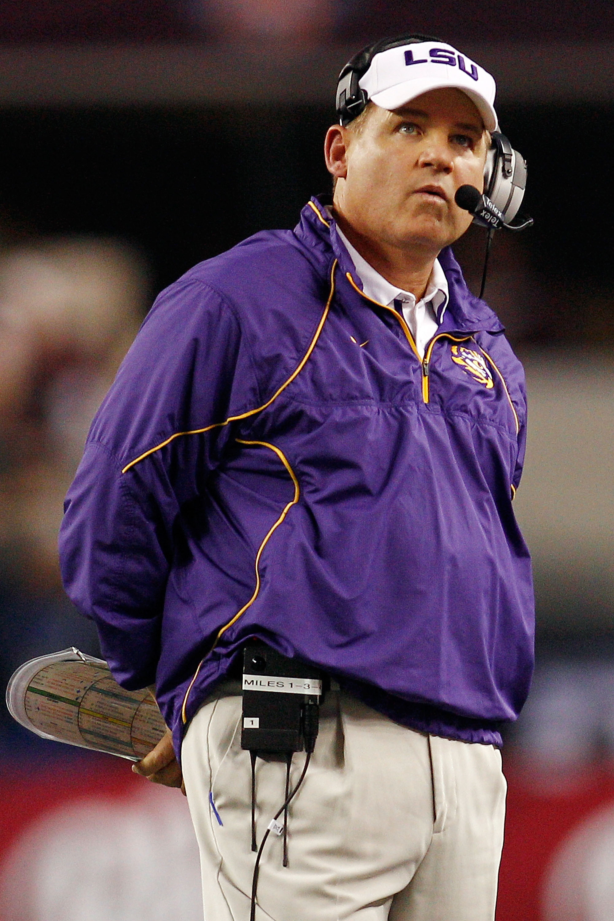 ARLINGTON, TX - JANUARY 07:  Head coach Les Miles of the Louisiana State University Tigers watches the score board during a timeout against the Texas A&M Aggies during the AT&T Cotton Bowl at Cowboys Stadium on January 7, 2011 in Arlington, Texas.  (Photo